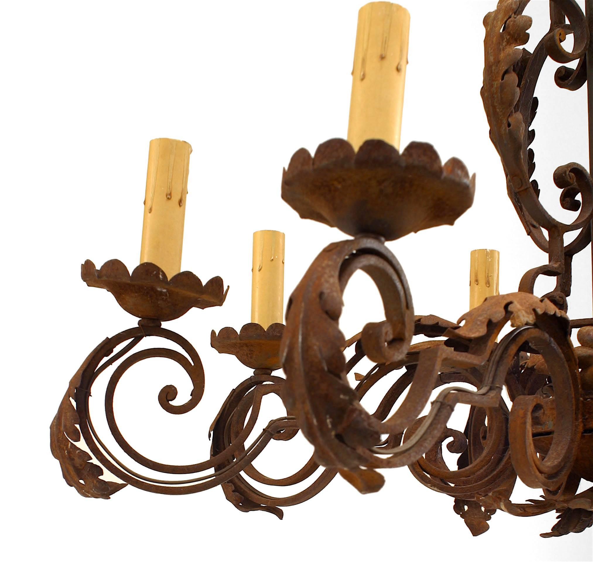 Italian Renaissance-style (20th Century) wrought iron chandelier with 8 scroll design arms and leaf trim.
