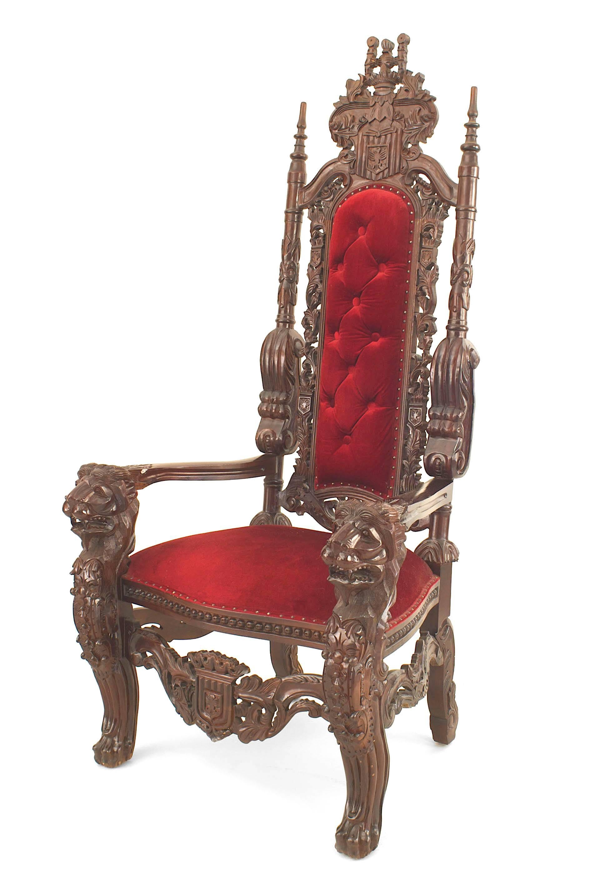 Italian Renaissance style (20th Cent) mahogany throne chair with carved lion arms and a high back carved crest and stretcher with a red velvet tufted back and seat (similar to Inv. CON076A)
