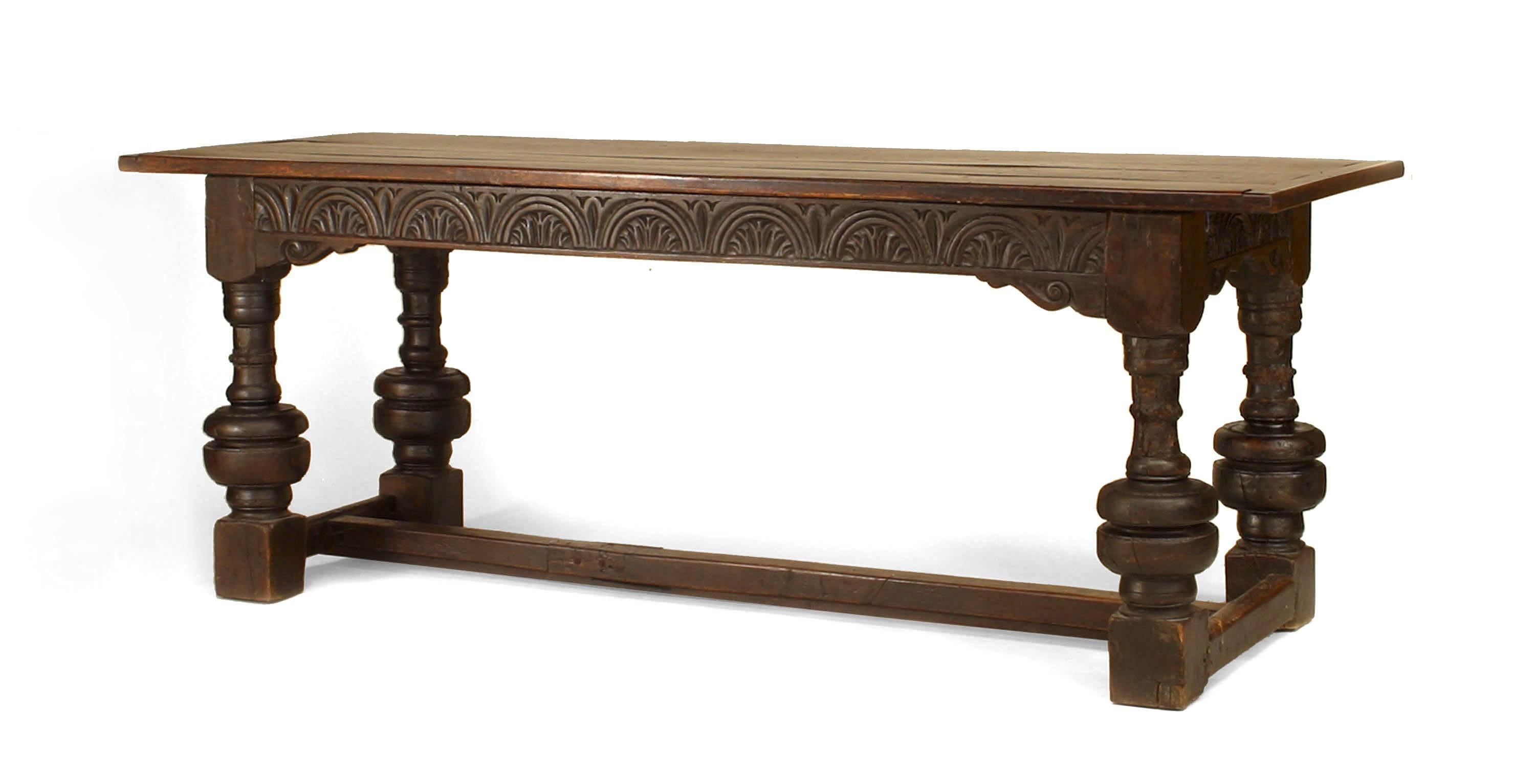 Italian Renaissance style (17th Century elements) oak refectory table with carved apron an bulbous shaped legs with a stretcher at base (plank top 19/20th Century).
