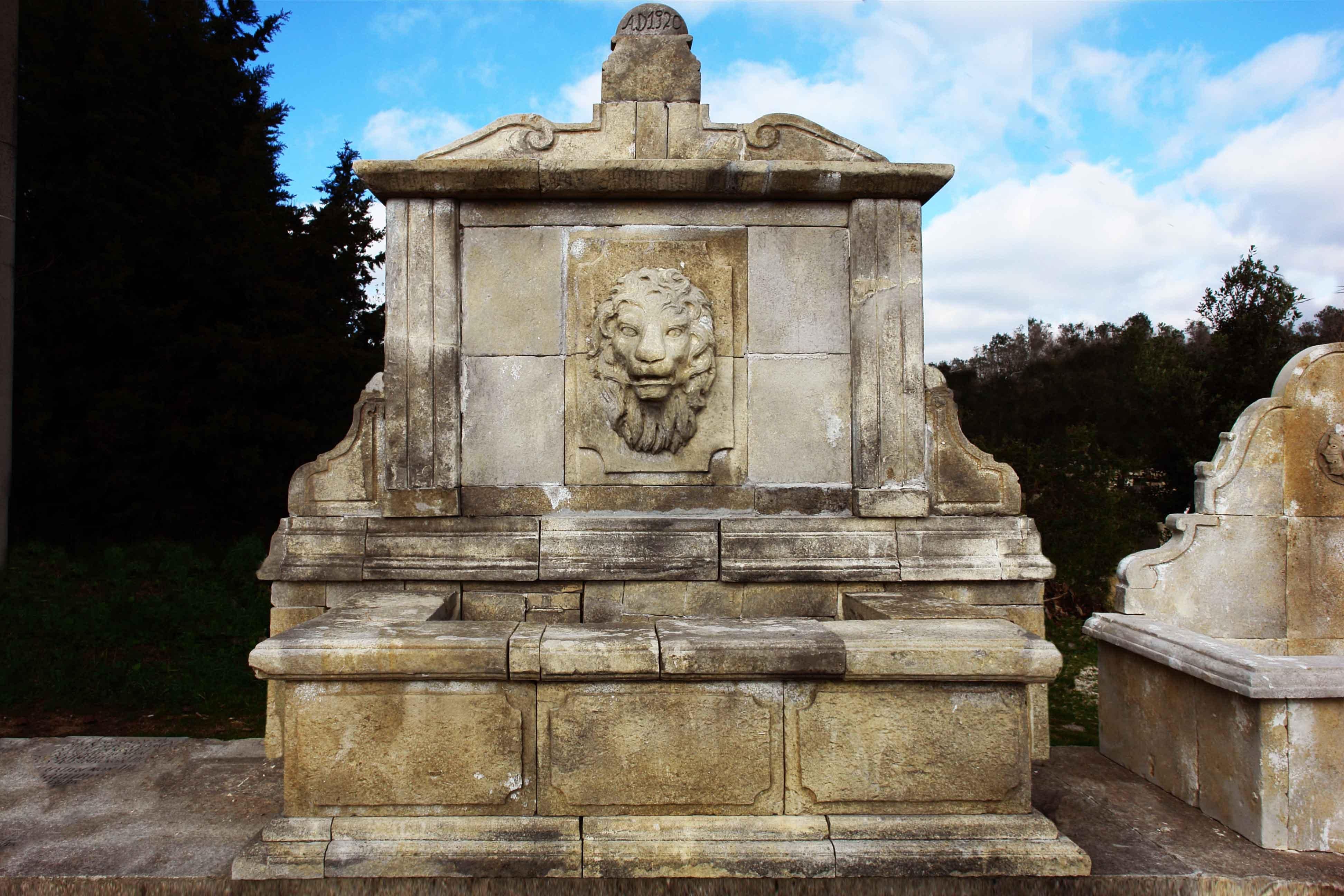 A monumental Italian Renaissance style wall fountain, with lion's head water fall on center, volutes on sides and panels on front of the basin.
High quality of Italian art work, all hand-carved in pure limestone, with antique hand-finishing.
Ready