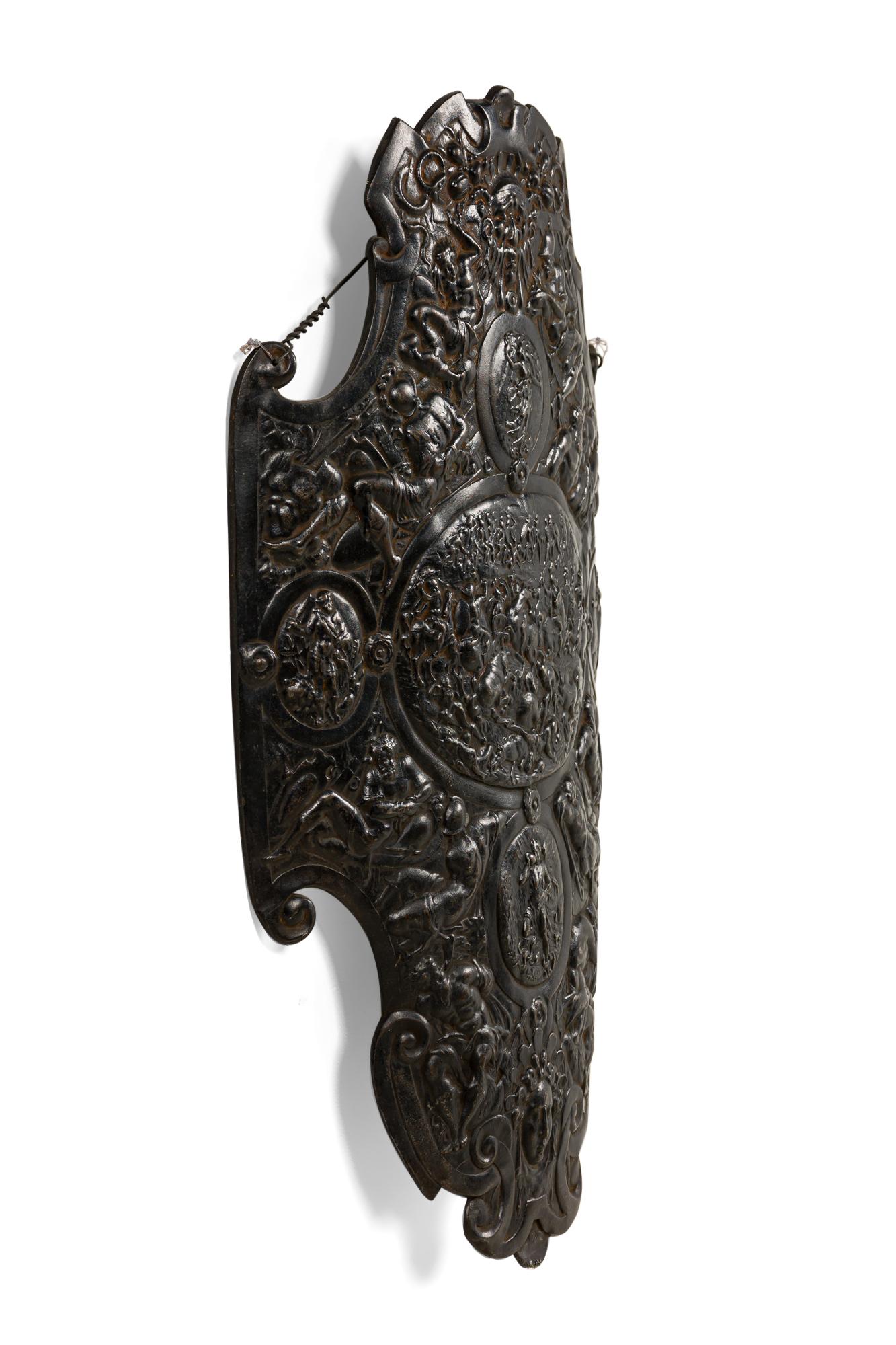 Italian Renaissance-style (20th Century) iron breast plate / wall plaque with figures and scenes in relief.
