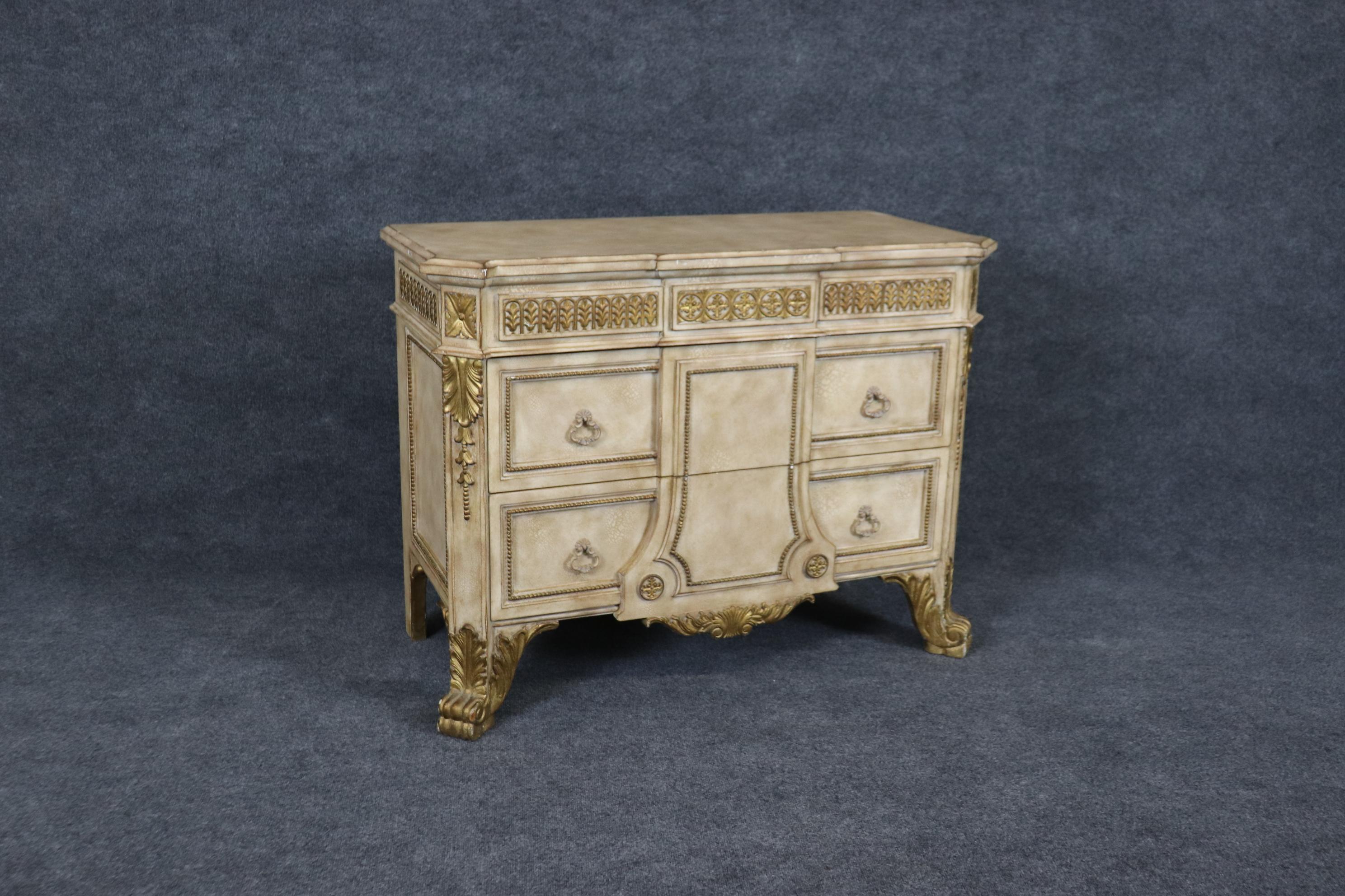 This is a beautiful commode done in the renaissance style with a paint decorated and gilded with metal hardware. The color palette is soft and muted and this will work in many design environments. Measures 44.25 wide x 20 deep x 33 tall. Dates to