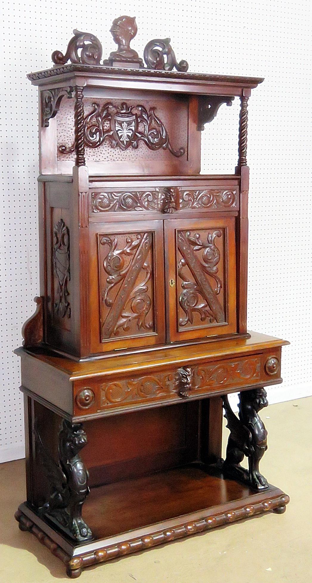 Italian Renaissance style secretary desk with a drop desk containing several compartments over 1 drawer and winged griffins.