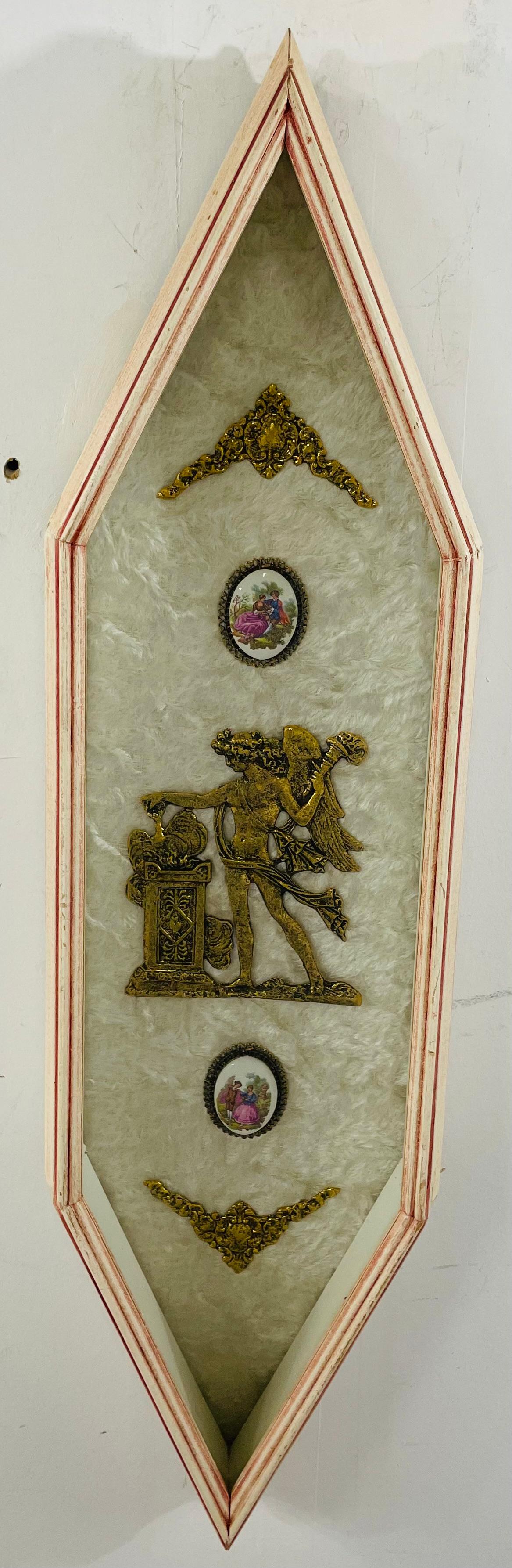 A pair of Italian Renaissance style wall decorative plaques. the hexagonal shaped plaques has each a fine brass floral design on top and bottom, two oval hand painted porcelain of a man courting a lady and in the middle one has a brass design of a