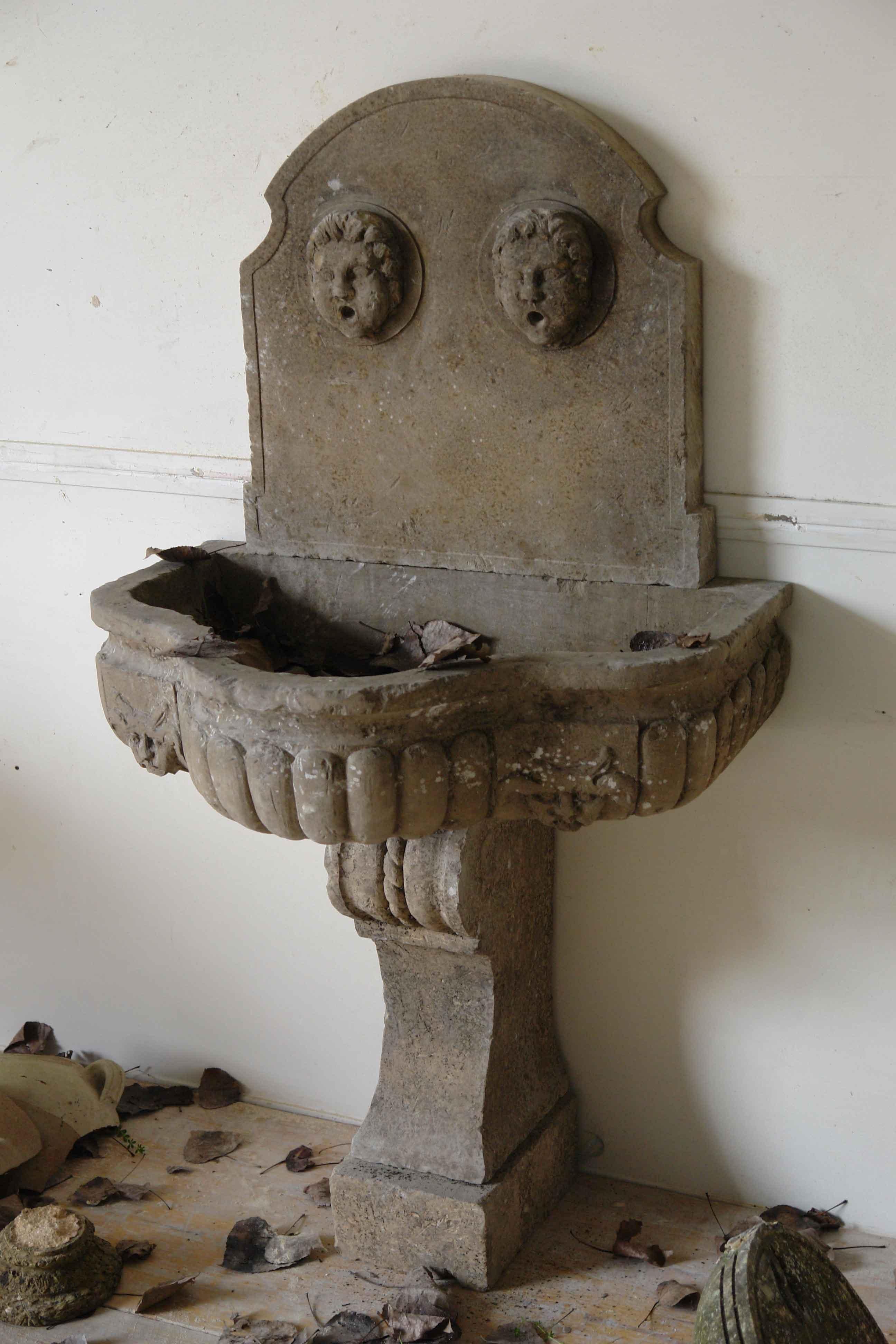 Hand-Carved Italian Renaissance Style Wall Fountain with Godrons Limestone Antique Patina For Sale