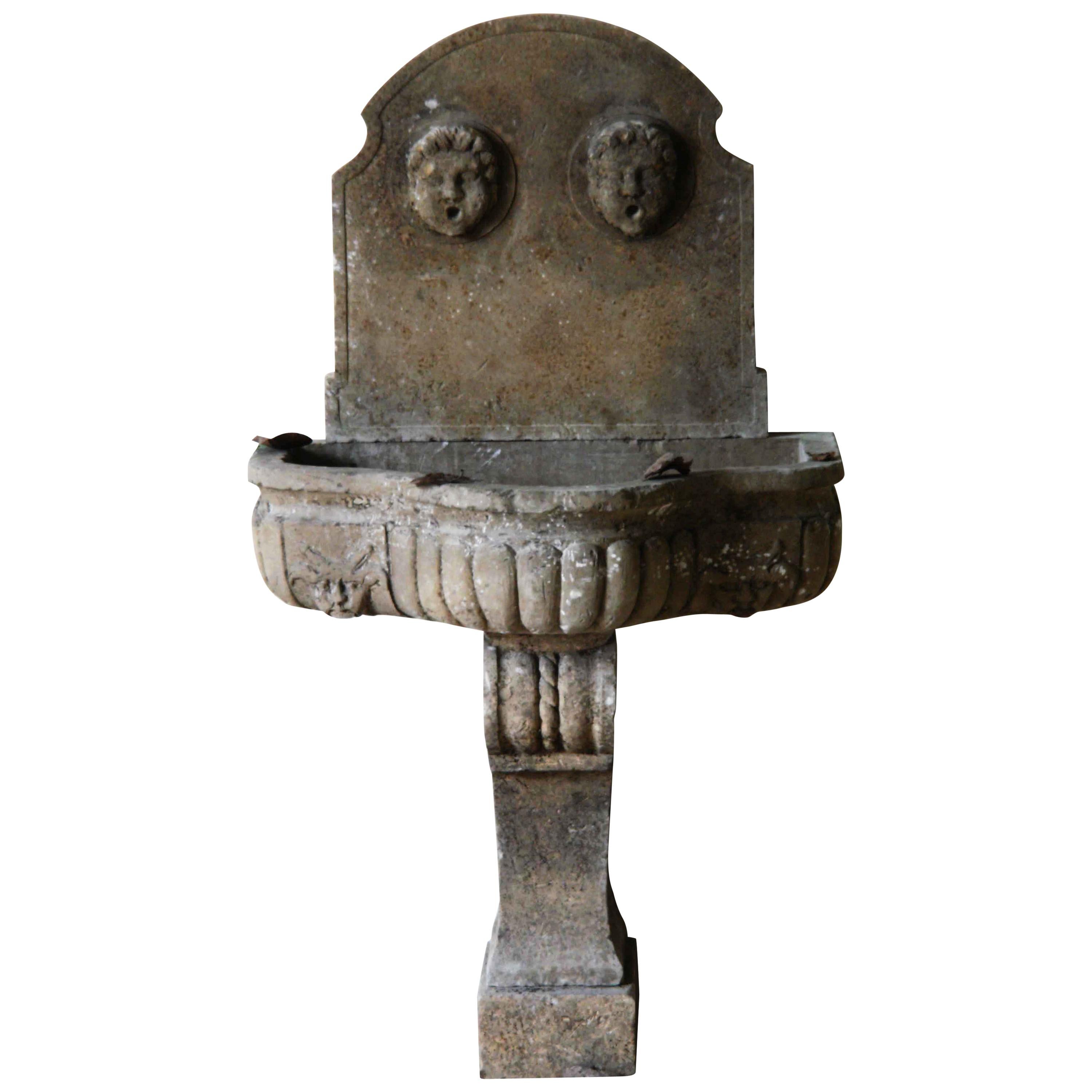 Italian Renaissance Style Wall Fountain with Godrons Limestone Antique Patina For Sale