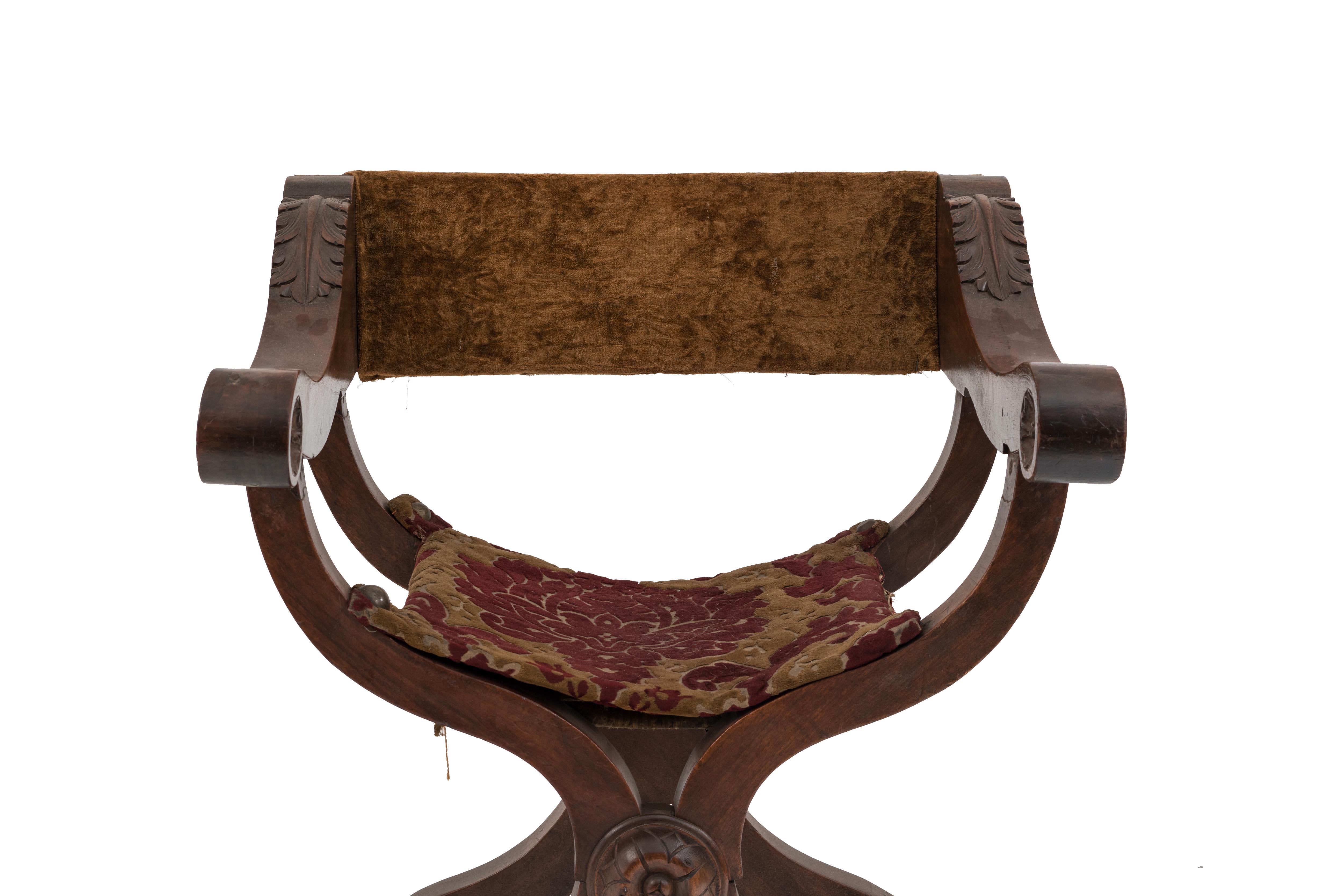 Italian Renaissance Savonarola style walnut arm chair with gold velvet back and red and gold cut velvet seat. (19th cent).
     
