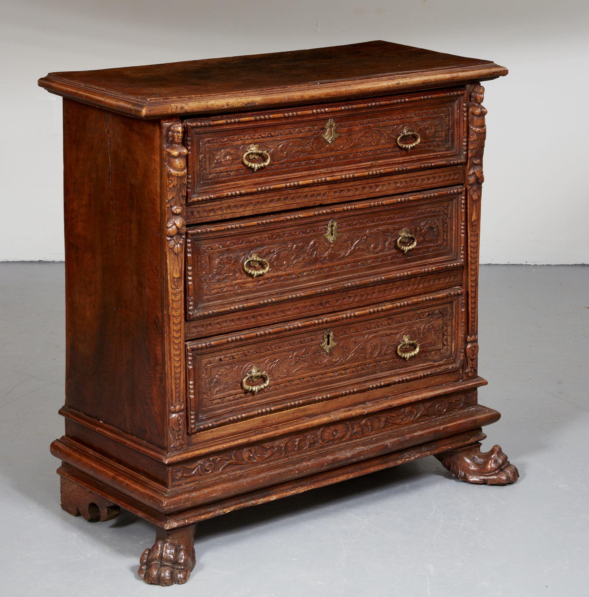 Very Fine Northern Italian (Tuscan) Renaissance commode, the molded top over three drawers with arabesque carved fronts and applied molded edges, the sides carved with term figures and standing on heavily molded base and standing on paw feet, the