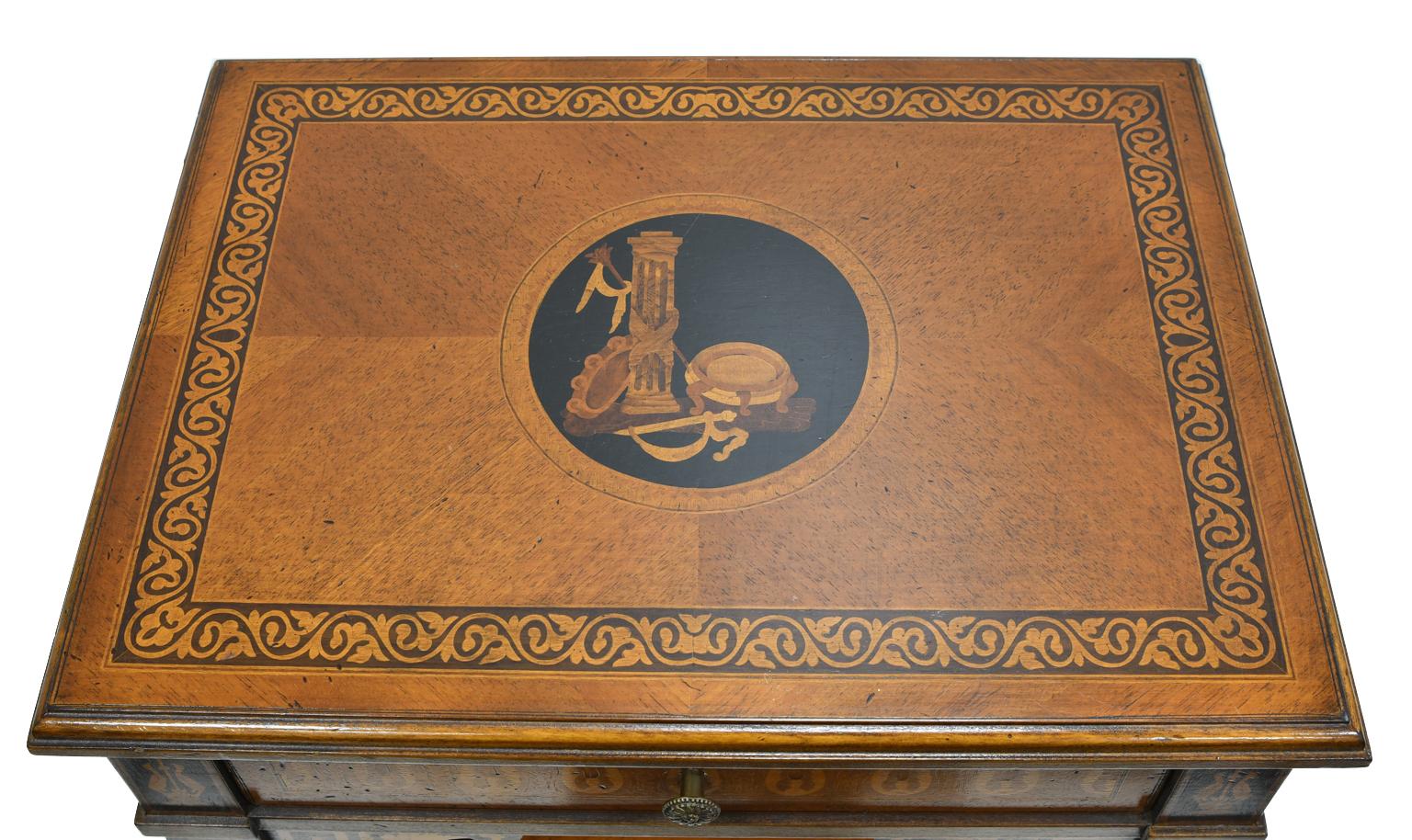 A handsome and well-crafted reproduction of an Italian neoclassical side table in walnut embellished with inlays of marquetry throughout by Italian cabinetmaker, Baggio, a firm known for its authentic reproductions of early Italian furniture. Table