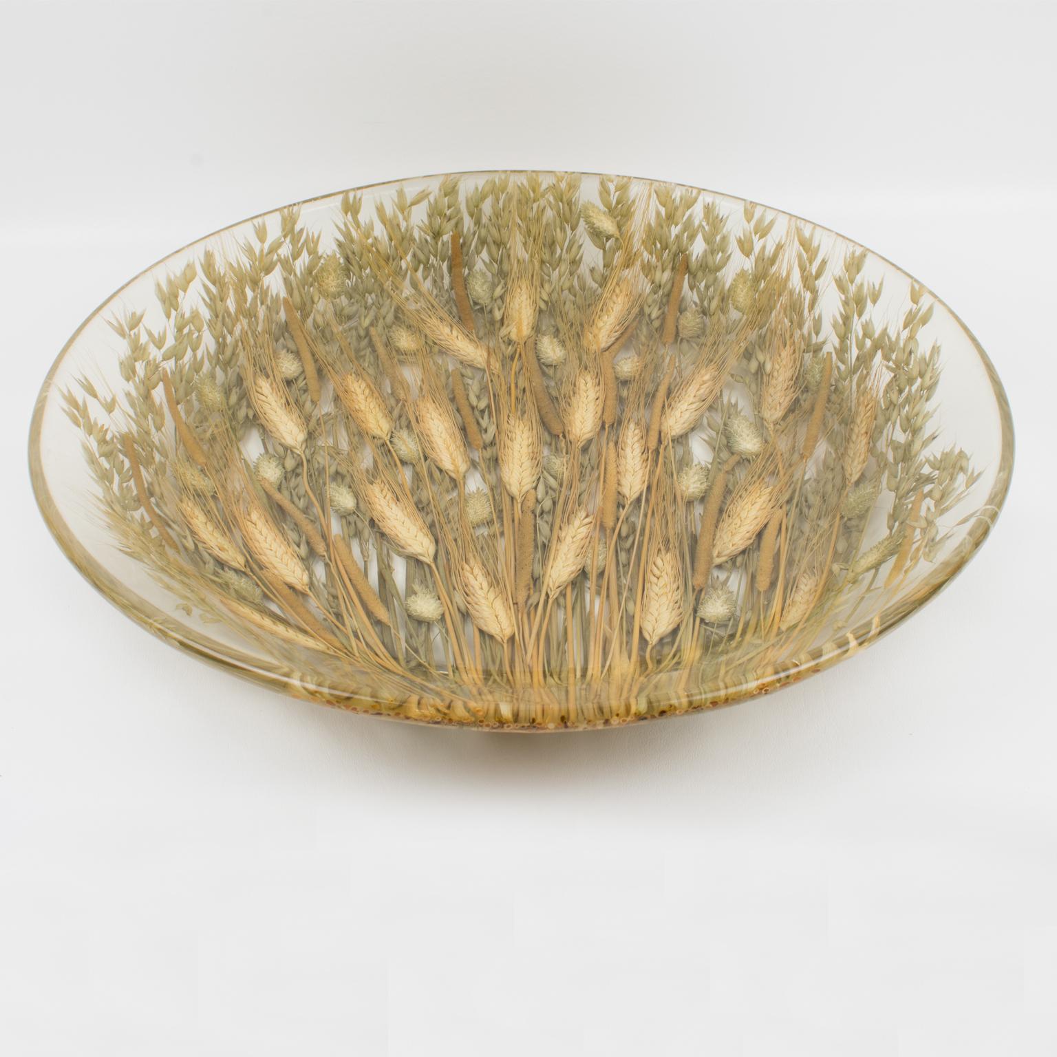 Lovely Italian serving platter or centerpiece. A rounded large bowl shape with raised edges and a natural organic touch, made of clear resin with real wheat embedded inside the material. Marked underside with the designer logo. Perfect for serving