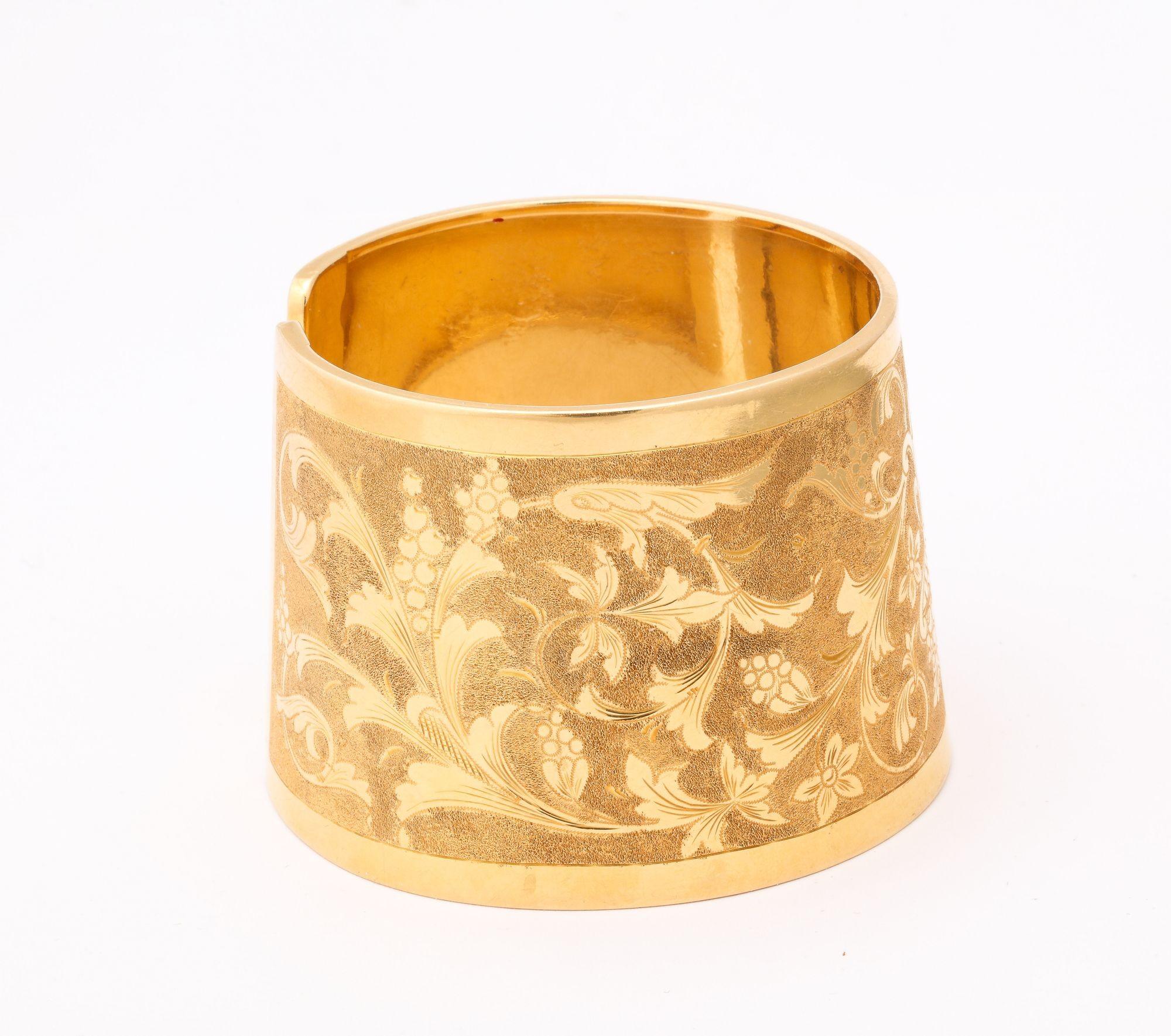 Italian 18 k Engraved Cuff with classical design of flowers and vines. This exceptional cuff can be worn on the wrist or the forearm it is beautifully executed and a one of a kind. It has a two-tone look.