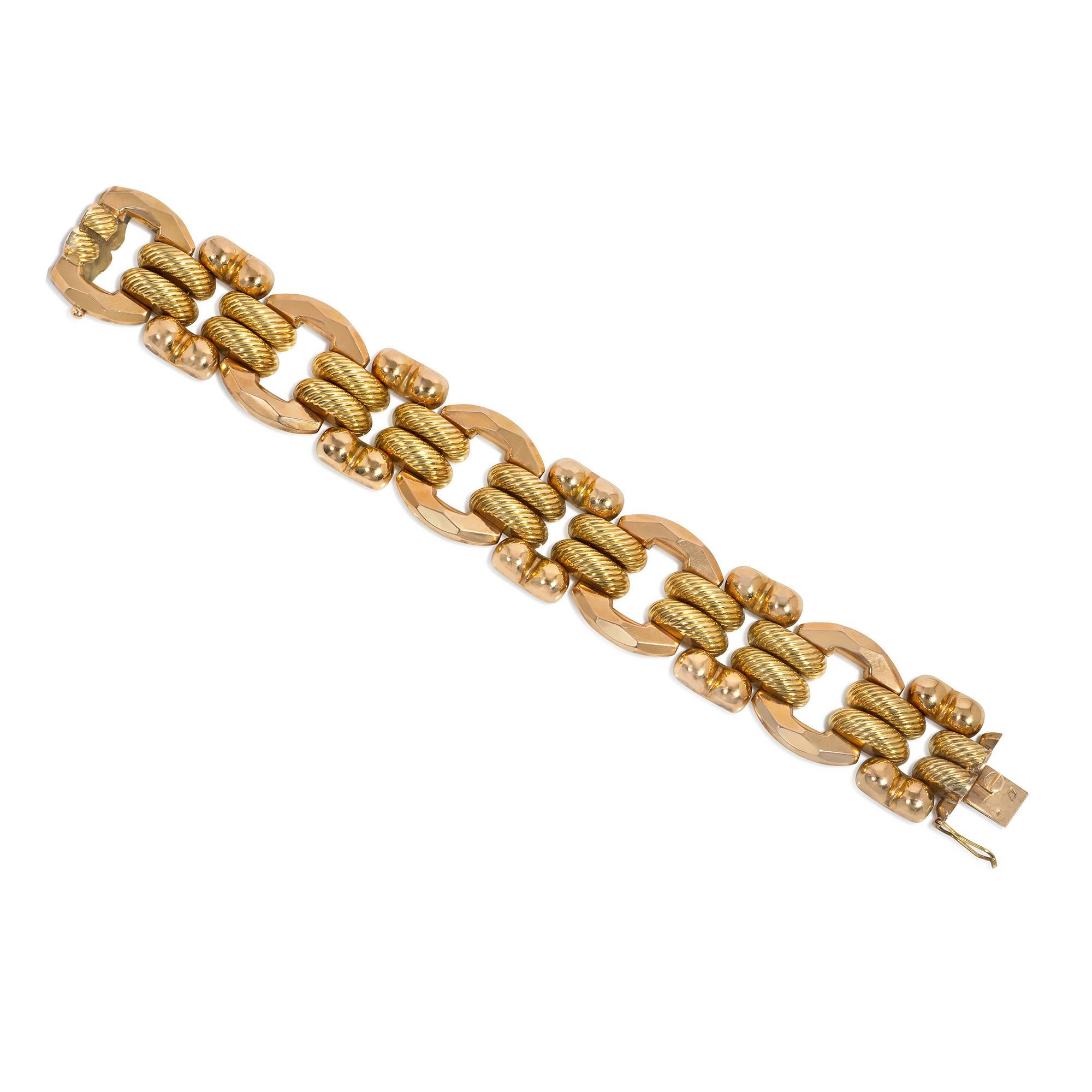 A Retro two-color gold tank bracelet featuring faceted oval rose gold links alternating with lobed rectangular links, attached by textured, half-round yellow gold spacers, in 18k. Italy.

* Includes letter of authenticity for insurance purposes
*