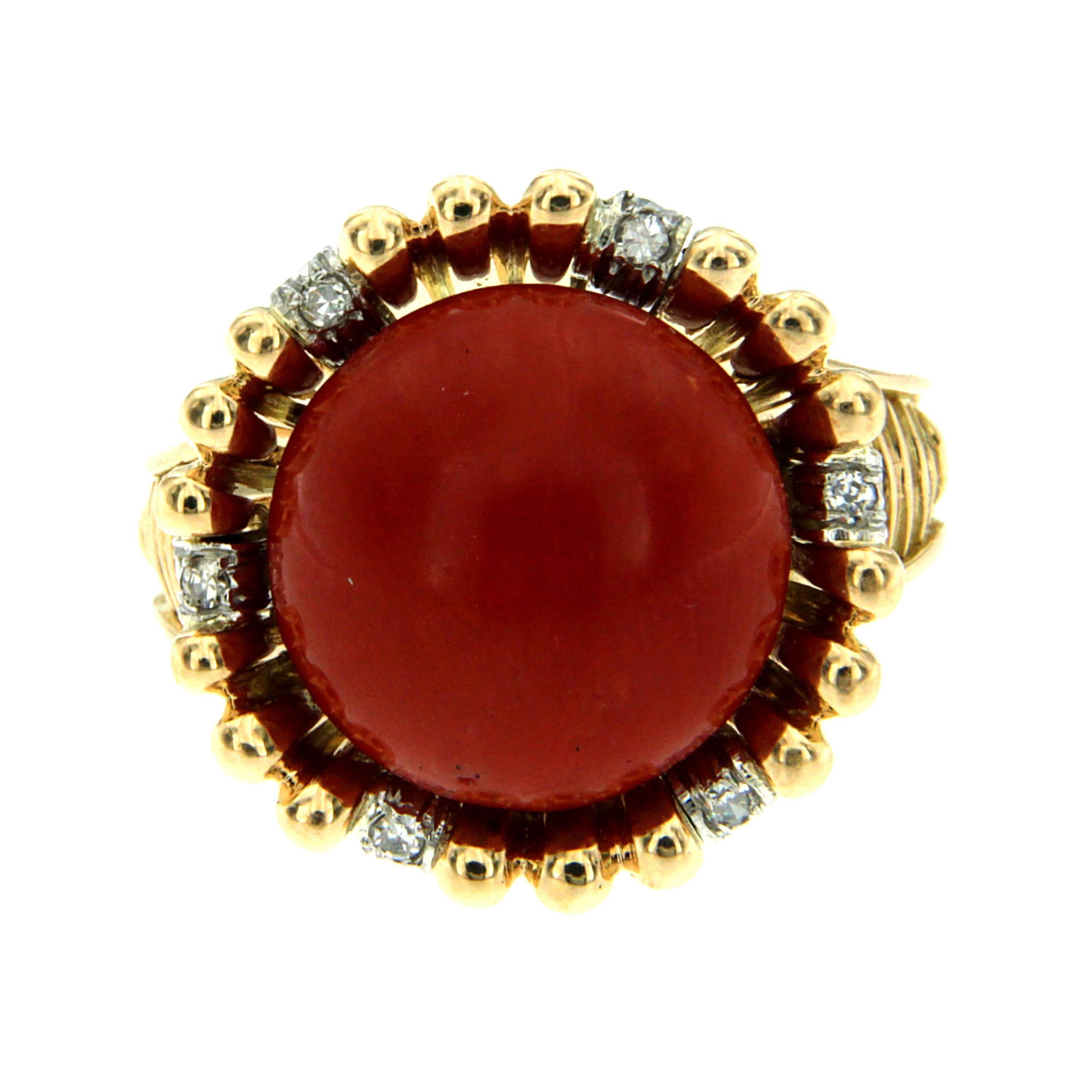 Authentic from 1950s this Beautiful ring is made of 18k yellow and white 18k Gold.
It is set with one exceptional large natural Mediterranean cabochon Coral surrounded by small diamonds.

CONDITION: Pre-Owned - Excellent 
METAL: 18k yellow and white