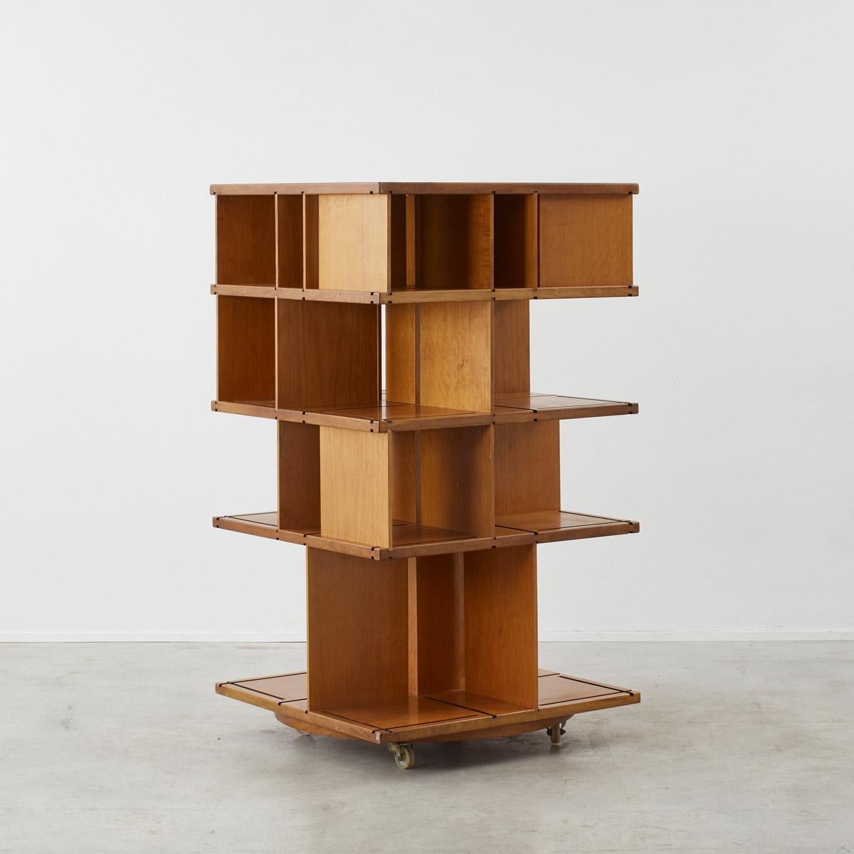A wooden Italian revolving bookcase with interchangeable partitions – a neat exercise in both function and design.

The piece is presented in original condition with some scuffs and indentations to the wood. Wheels in good working order. Can be