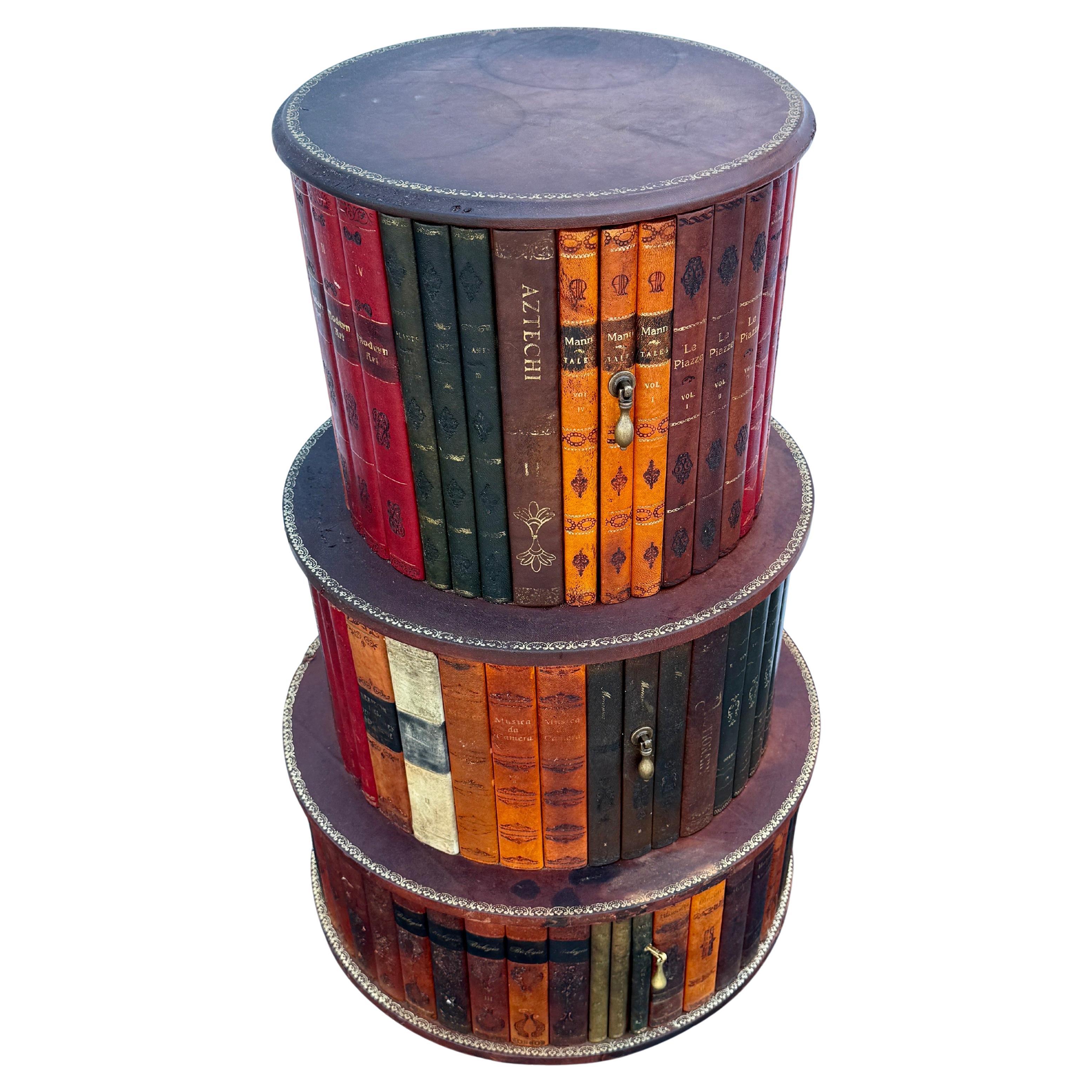 Charming Chesterfield-like round gilt tooled 3 tier stacked end or side table from the Mid-20th Century Italy. Vintage faux library books in the style of trompe-l'oeil with gilt edges and plenty of storage throughout. Each of the 3 levels has a