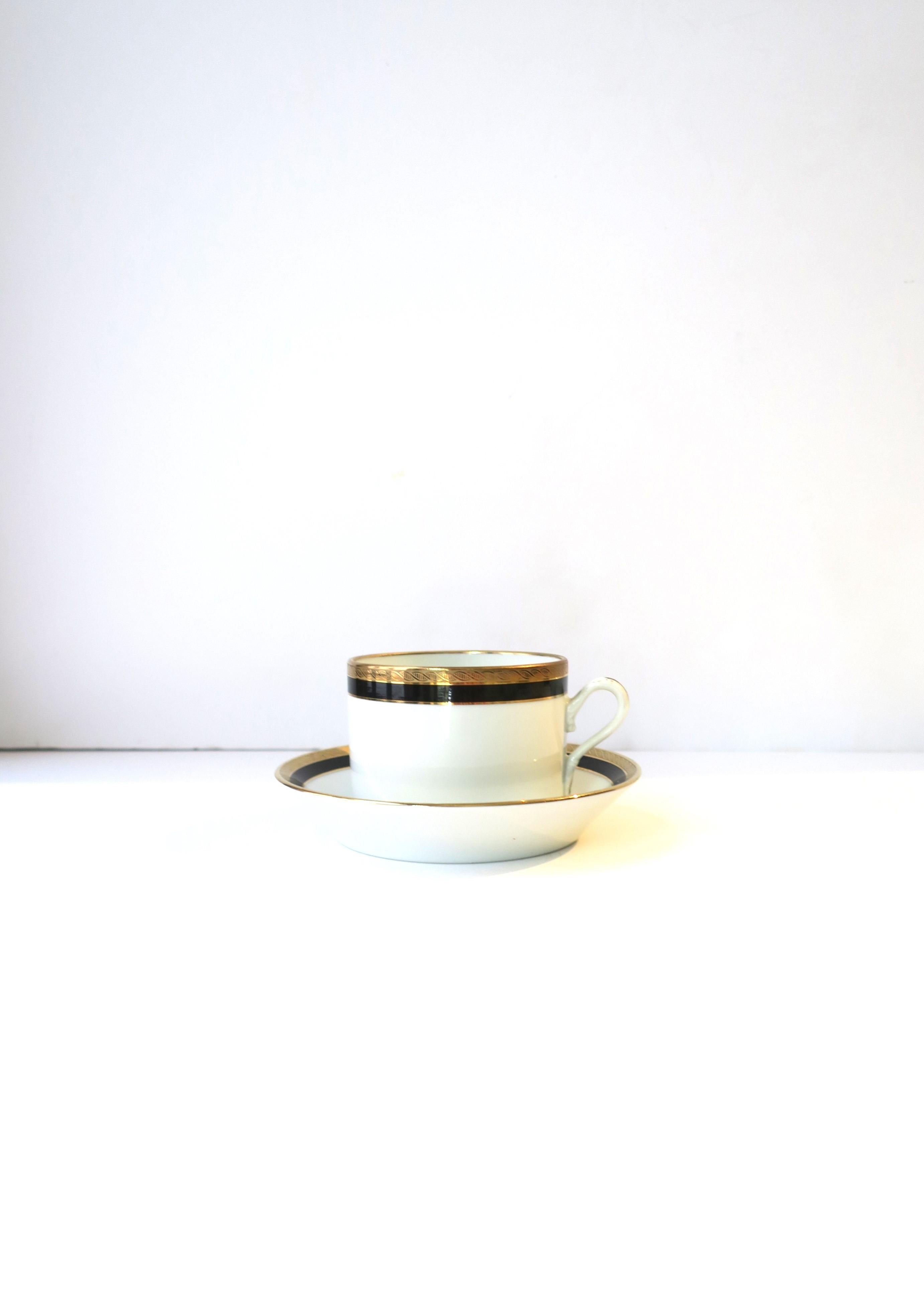 **Two available (as shown), each sold separately, as per listing. 

A beautiful and elegant Italian white porcelain, with black and gold, coffee or tea cup and saucer by designer Richard Ginori, circa mid-20th century, Italy. Colors include black,