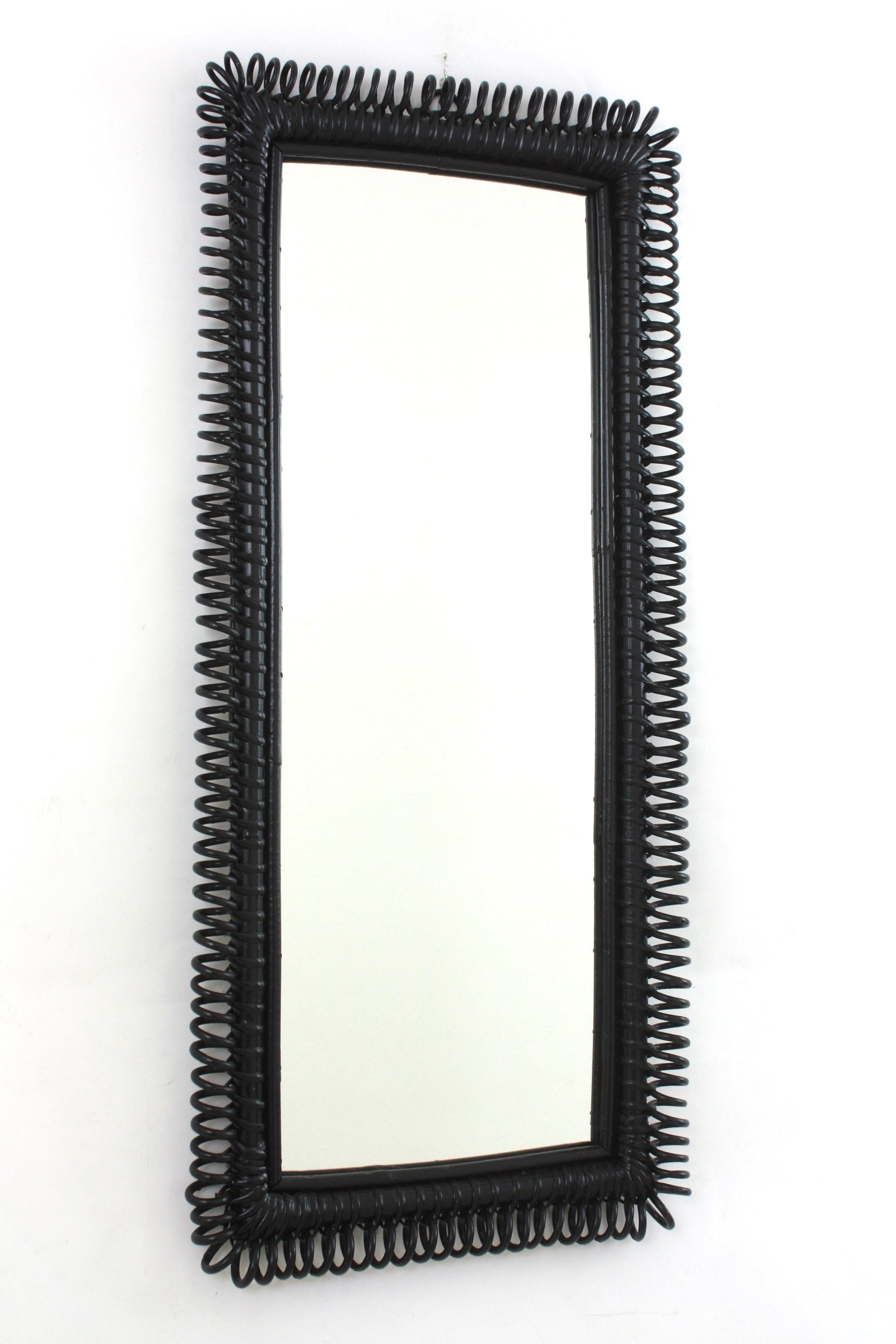 Midcentury Black Patinated Franco Albini Rattan Rectangular Mirror
___________________________________________________________
A highly decorative Mid-Century Modern mirror with undulated rattan frame attributed to Franco Albini, Italy, 1950s.
Rare