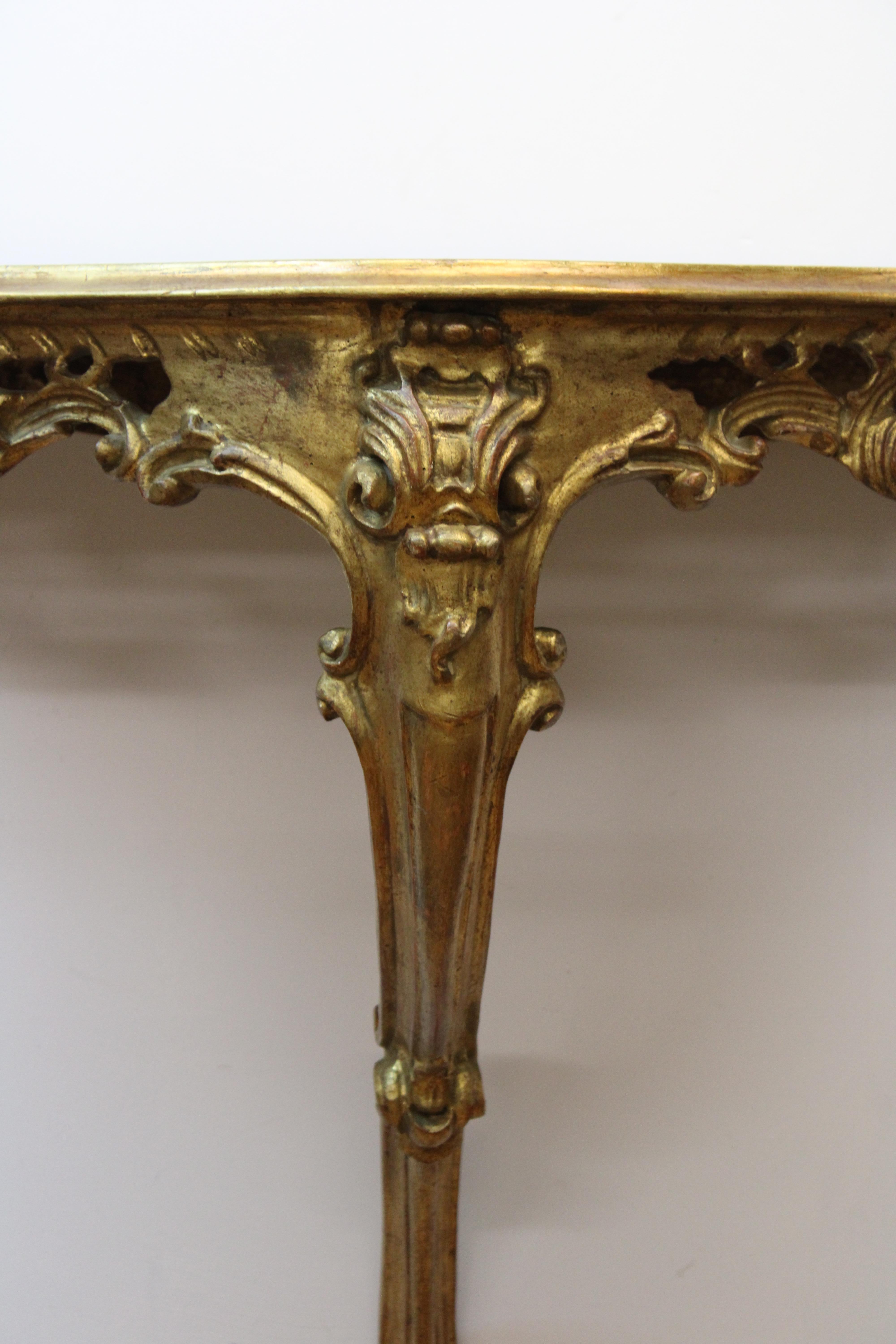 C. mid 20th century

Italian Rocco style gilt wall mounted console table.