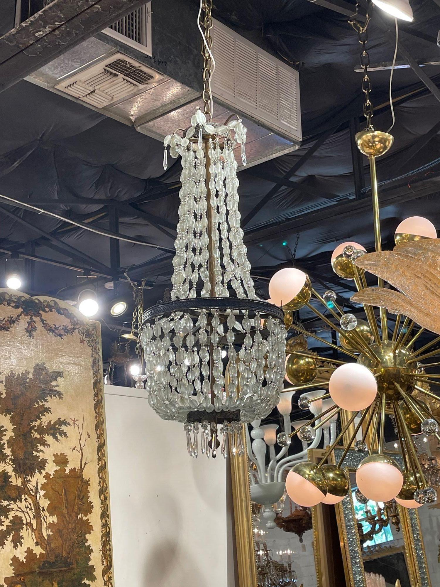 Early 20th century Italian rock crystal chandelier. Circa 1920. The chandelier has been professionally re-wired, cleaned and is ready to hang. Includes matching chain and canopy.