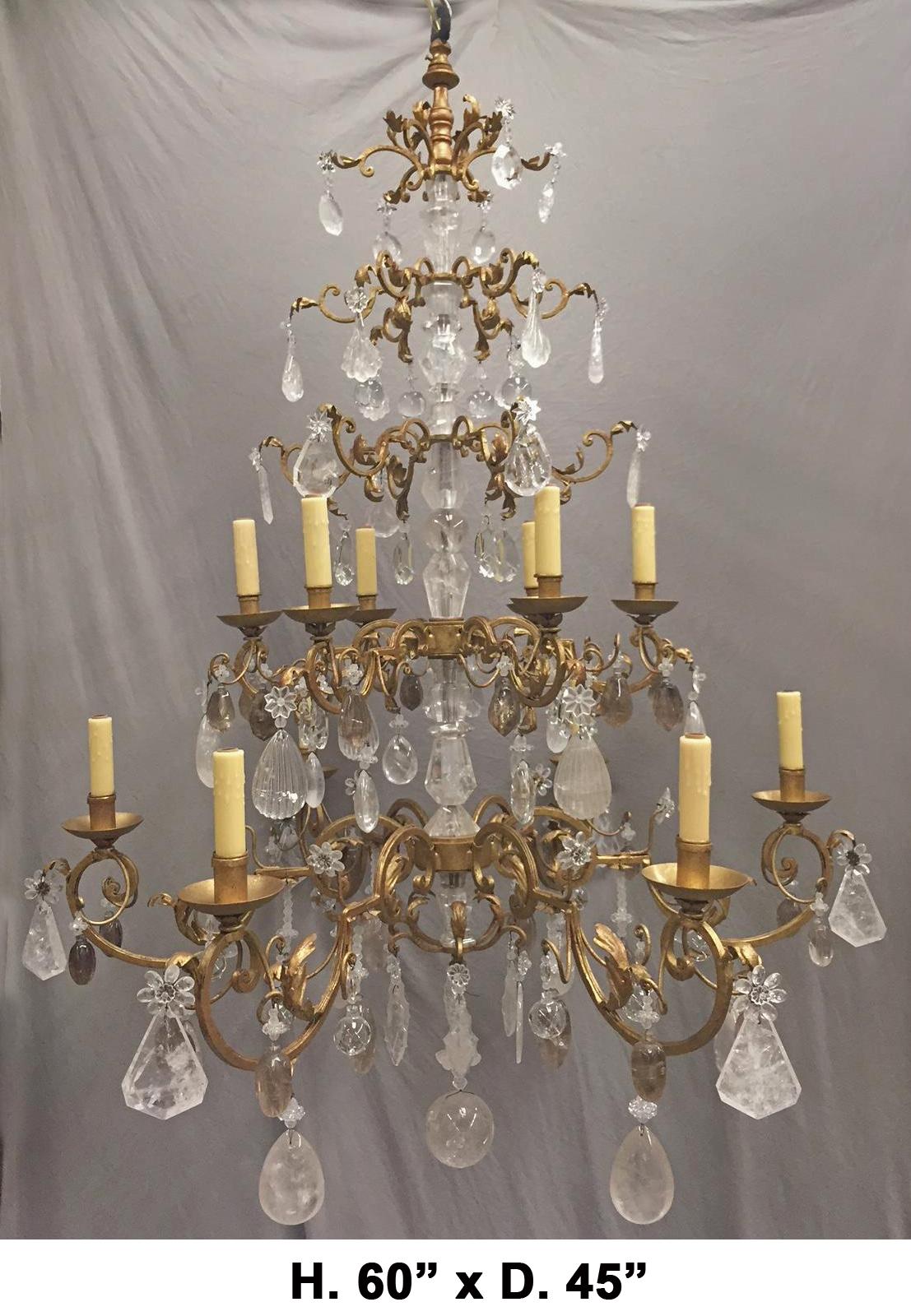 Outstanding hand-carved and polished rock crystal and hand-forged wrought iron two-tier twelve-light chandelier.

The spectacular hand-carved rock crystal center shaft is surrounded by five tiers of finely hand-forged wrought iron foliage motif