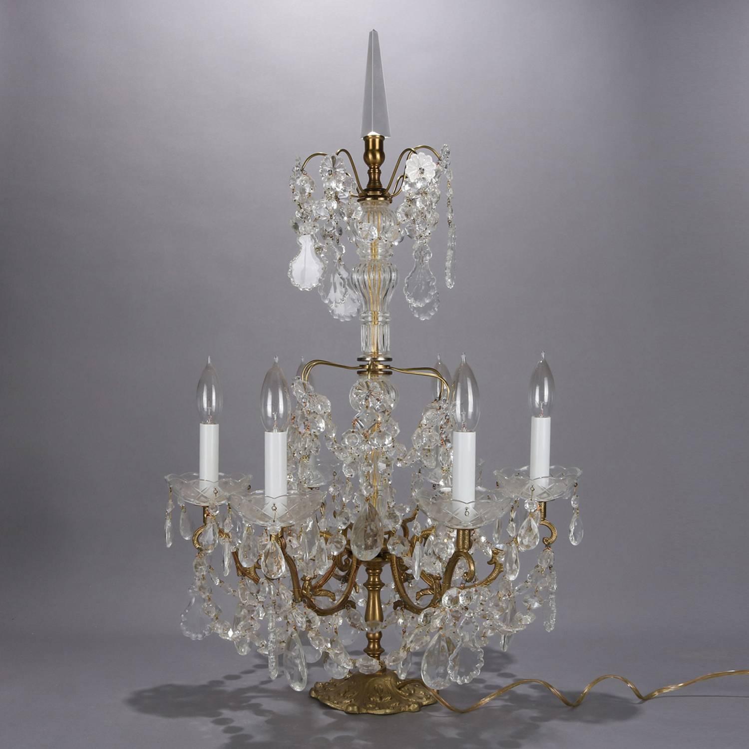 Pair of Italian branch table chandeliers feature scroll and foliate form gilt metal bases each with six candle lights, strung bead and rock crystals throughout, circa 1900

Measures: 30