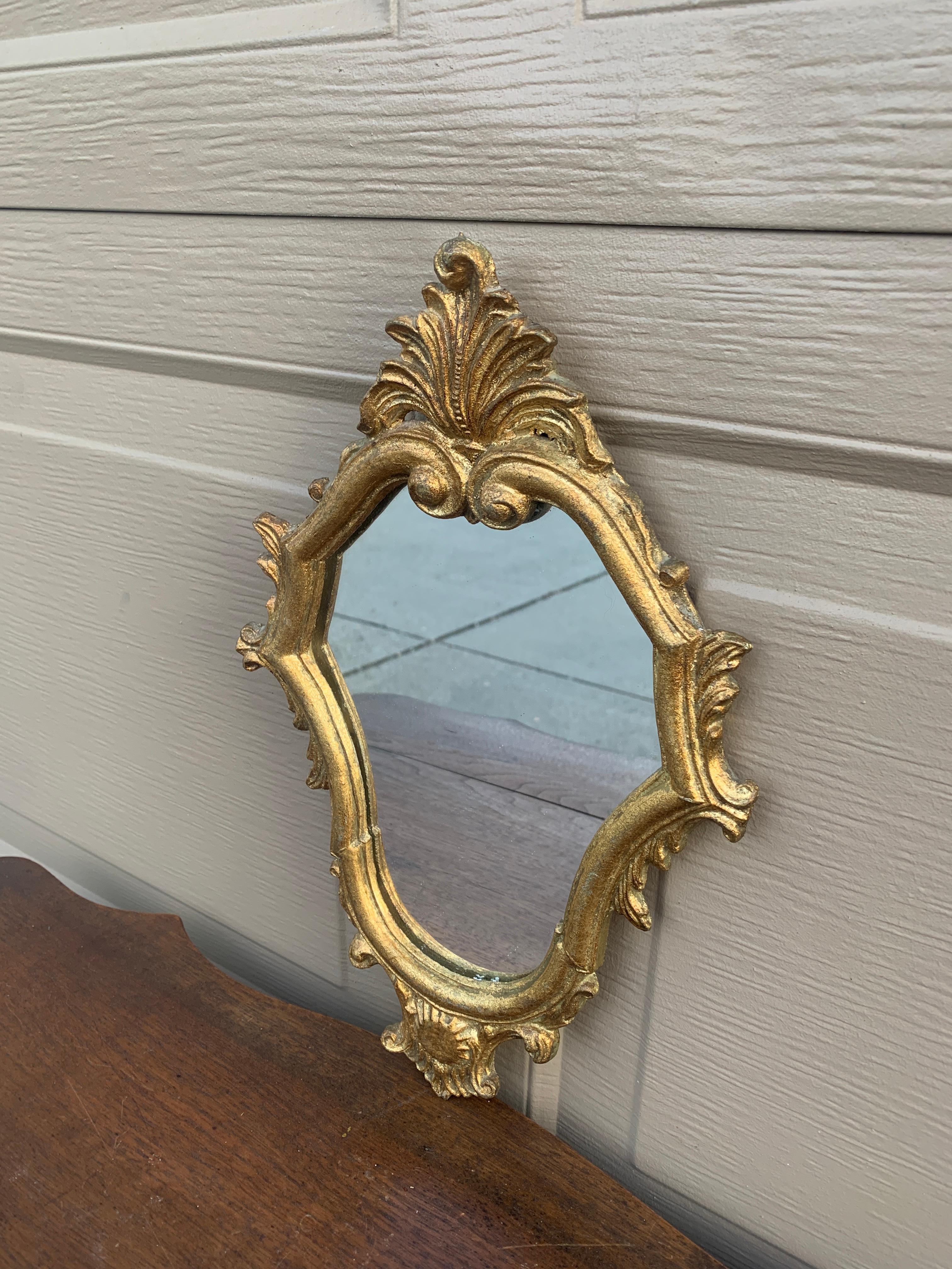 A gorgeous Rococo Baroque style gilt wood framed mirror

Italy, Mid-20th Century

Measures: 9.25
