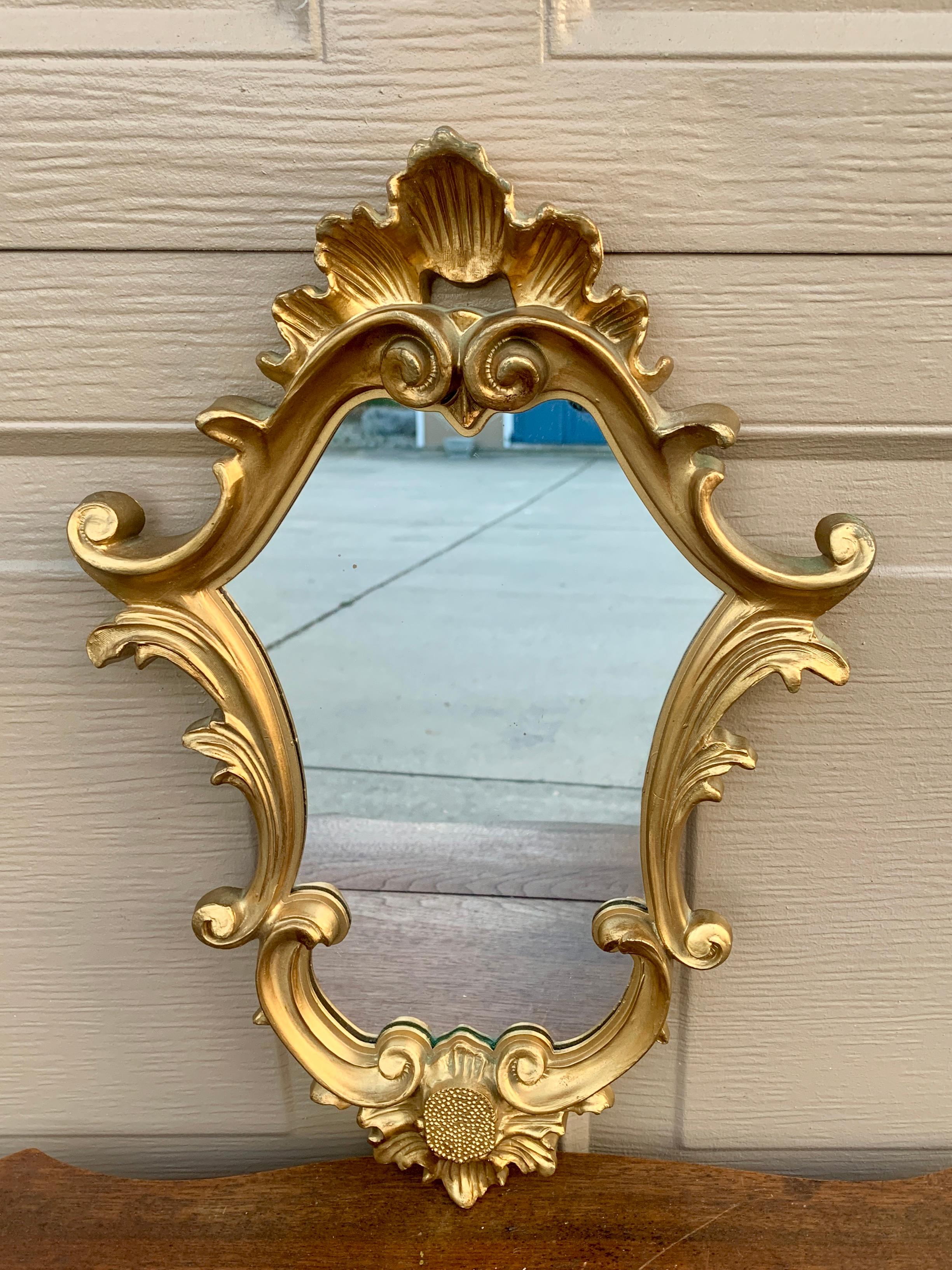 A gorgeous Rococo Baroque style gilt wood framed mirror

Italy, Mid-20th Century

Measures: 11
