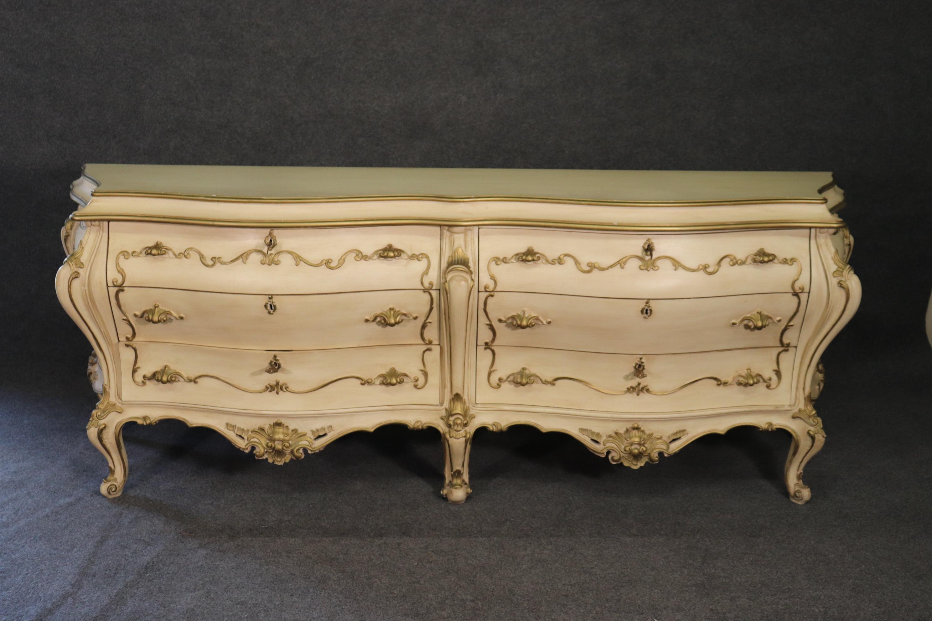 This is a beautiful Italian made dresser. The dresser is in good condition and has its original finish. The back has a panel that has been dented but this does not affect the piece in any way. The dresser measures 91 wide x 20 deep x 33 tall.