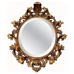 Italian Rococo Carved Giltwood Oval Mirror, 1900s