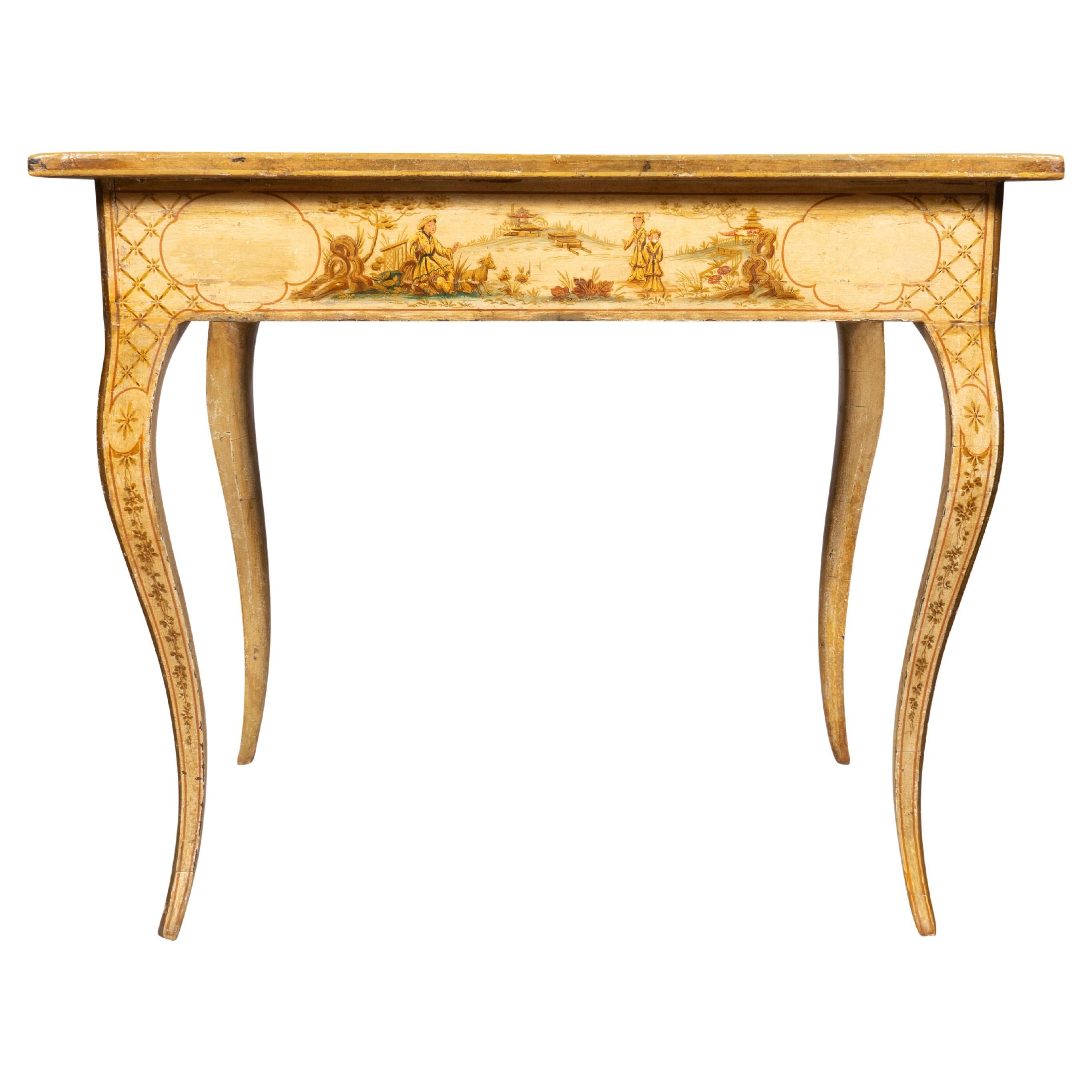 Piano rettangolare con scena dipinta di figure a tavola con rocce, padiglioni e alberi all'interno di un cartiglio e con pennacchi floreali. Decorato in verde chiaro, crema, marrone e sottili accenti dorati. Il fregio è decorato in modo simile e
