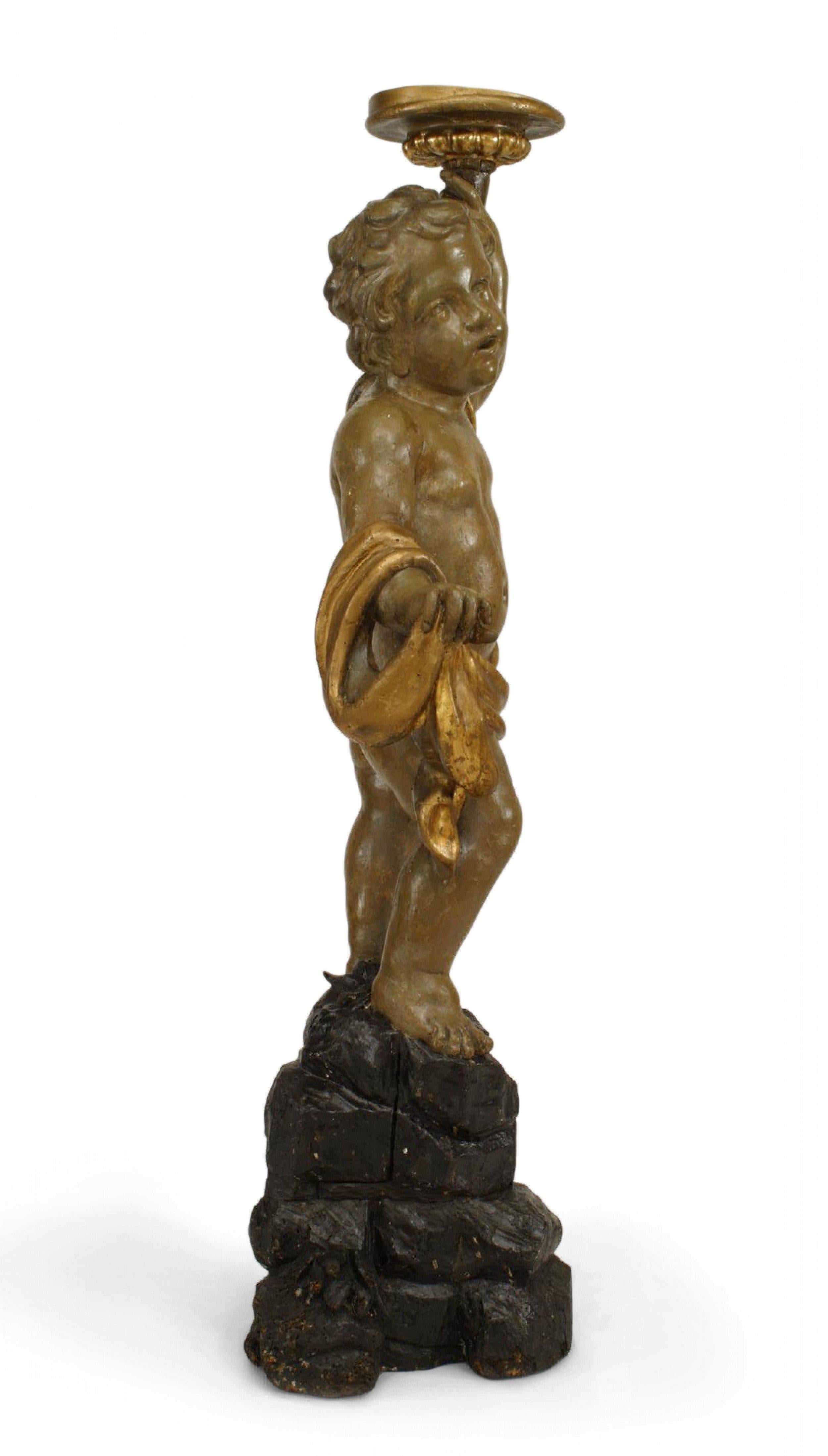 Italian Rococo (18th Cent) green painted life size cupid figure with a gold drape and holding a plate.
 