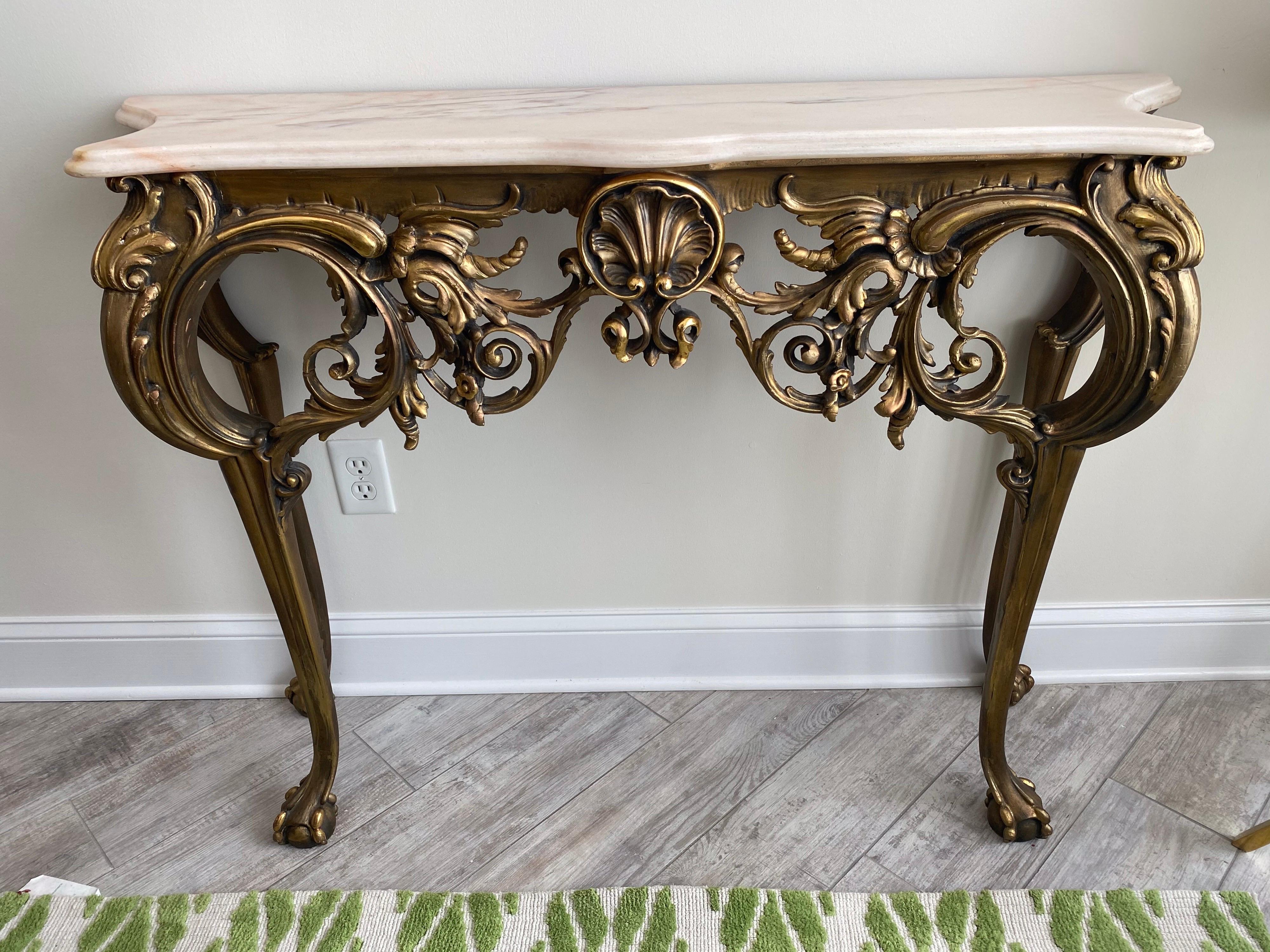 Carved and gilded Baroque style console with marble top.
