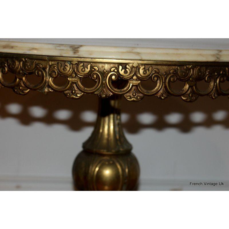 Italian Rococo onyx marble coffee table brass vintage circular console
This Italian side table marble with brass base by Orsenigo Furniture from Italy, 1960s is in good original condition. 
Wear consistent with age and use. It could be a lovely