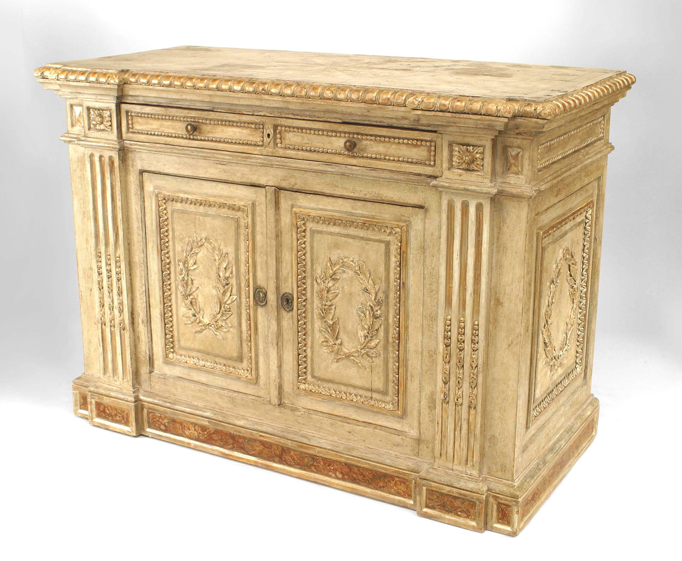 Italian Rococo chest of drawers coated in grey paint and accented with silver gilt trim and decorative carvings, namely classicizing laurel wreath and fluted column motifs. The piece is also raised upon a faux marbelized base and contains two