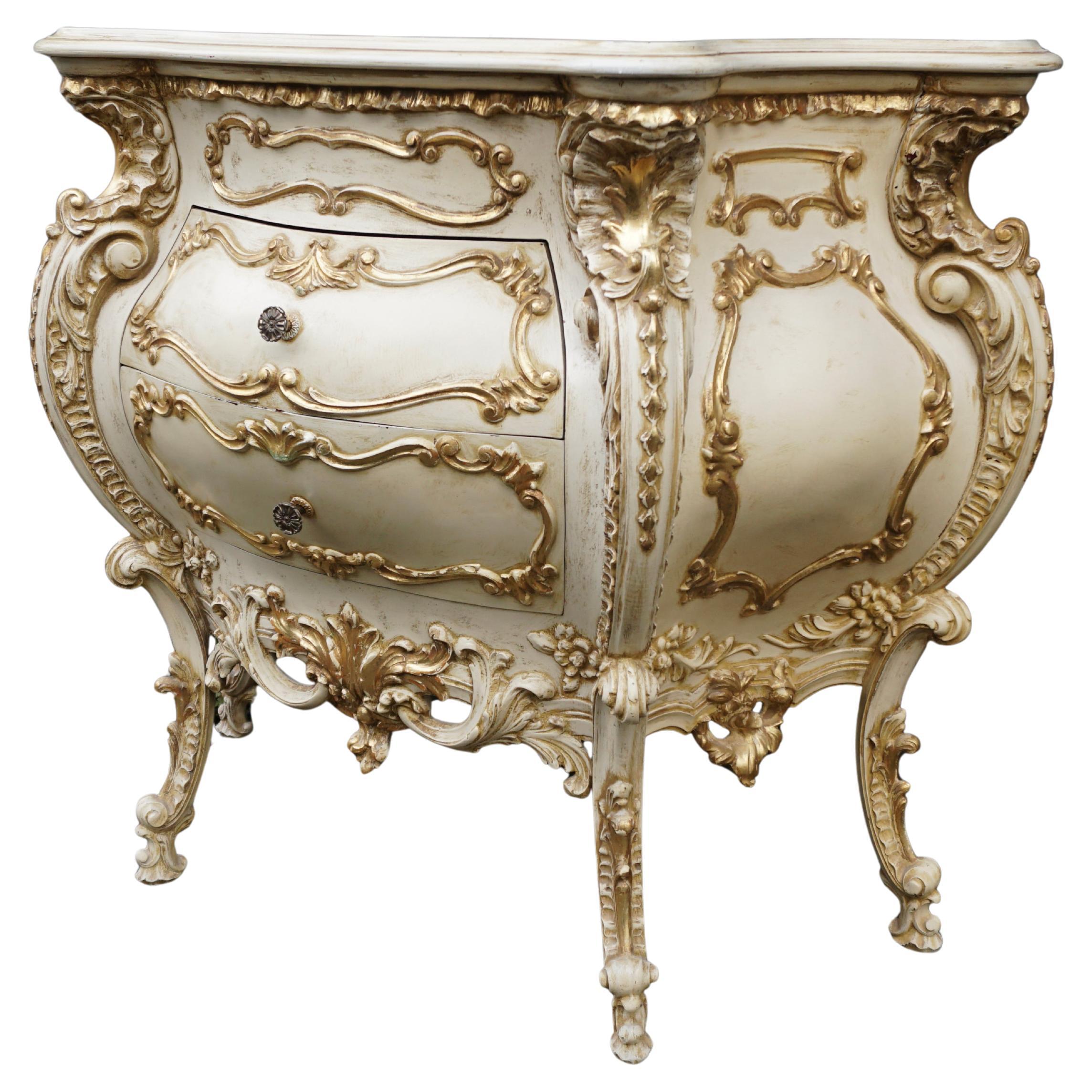 Italian Rococo Revival Bombe Commode with Gilded Details and Marbled Glass Top, 1940s

This extraordinary Italian Rococo Revival commode captures the lavish elegance and theatrical flair of Venetian craftsmanship from the 1940s. Entirely hand-carved