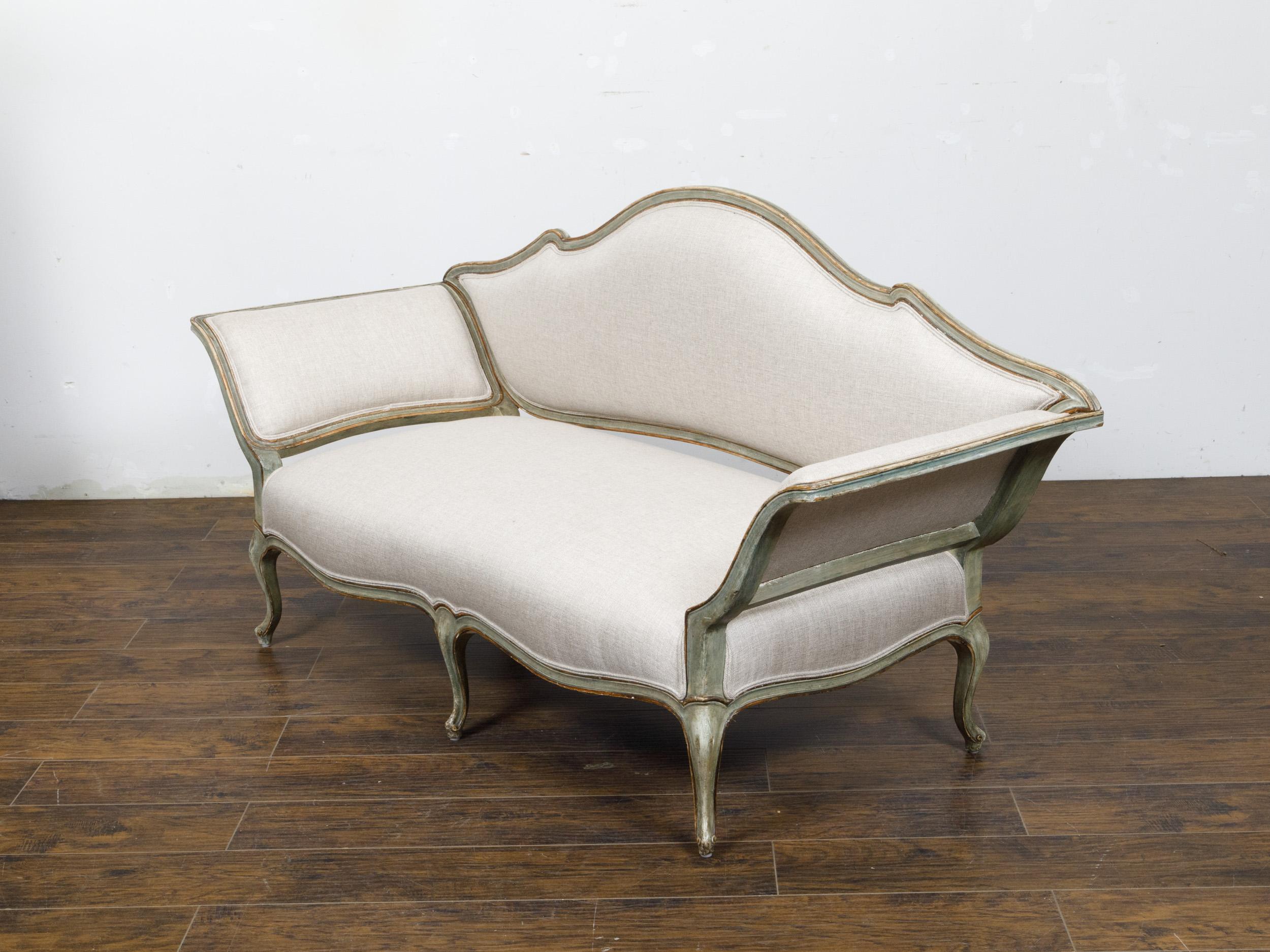 An Italian Rococo style settee from the 19th century with gray green painted finish, out-scrolling arms, shaped back and cabriole legs. This Italian Rococo style settee from the 19th century is a graceful blend of elegance and historical charm. It