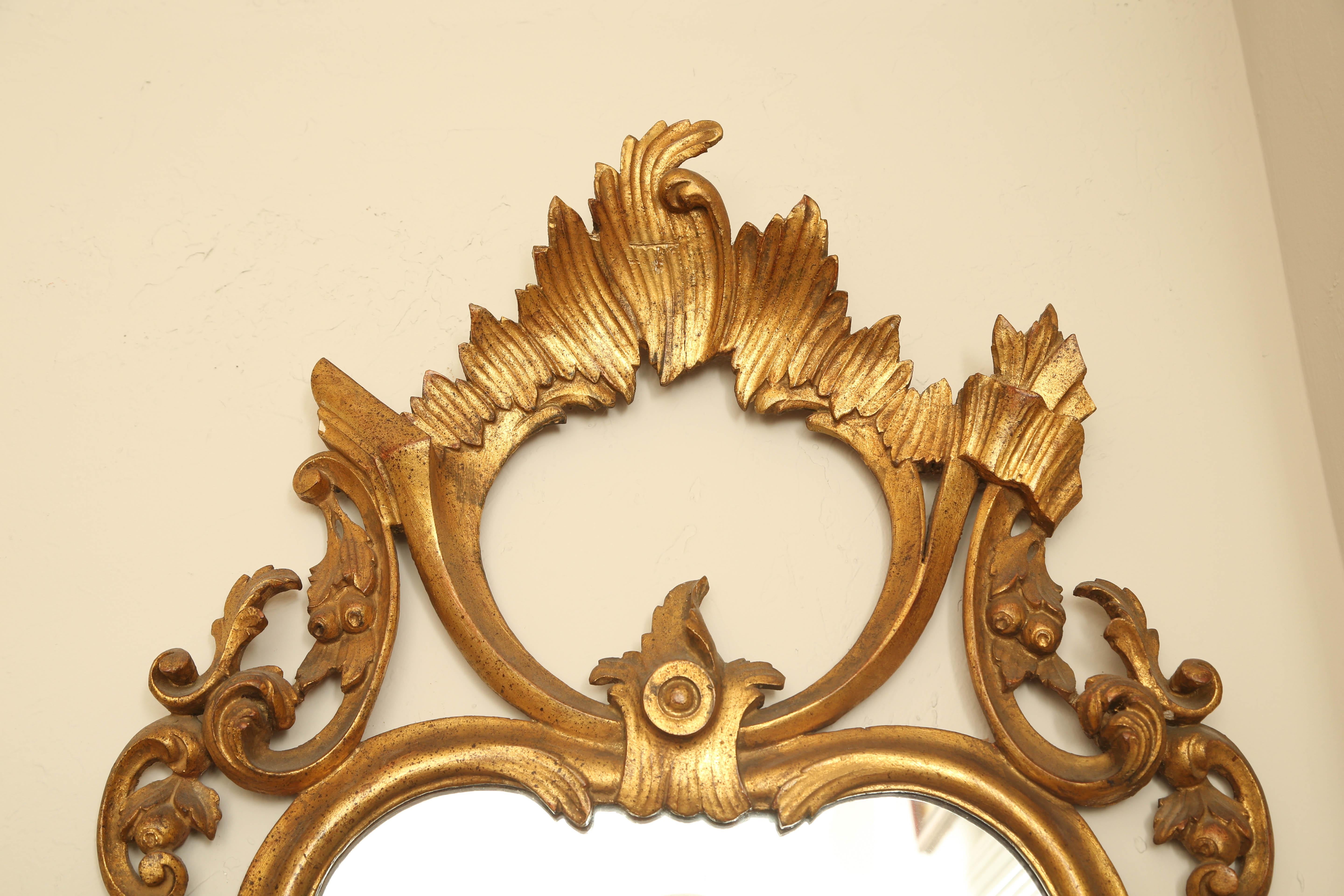 20th Century Italian Rococo Style Carved and Gilded Mirror For Sale