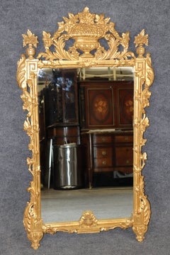 Italian Rococo Style Carved Gilt Mirror With Floral Accents