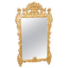 Italian Rococo Style Carved Gilt Mirror With Floral Accents