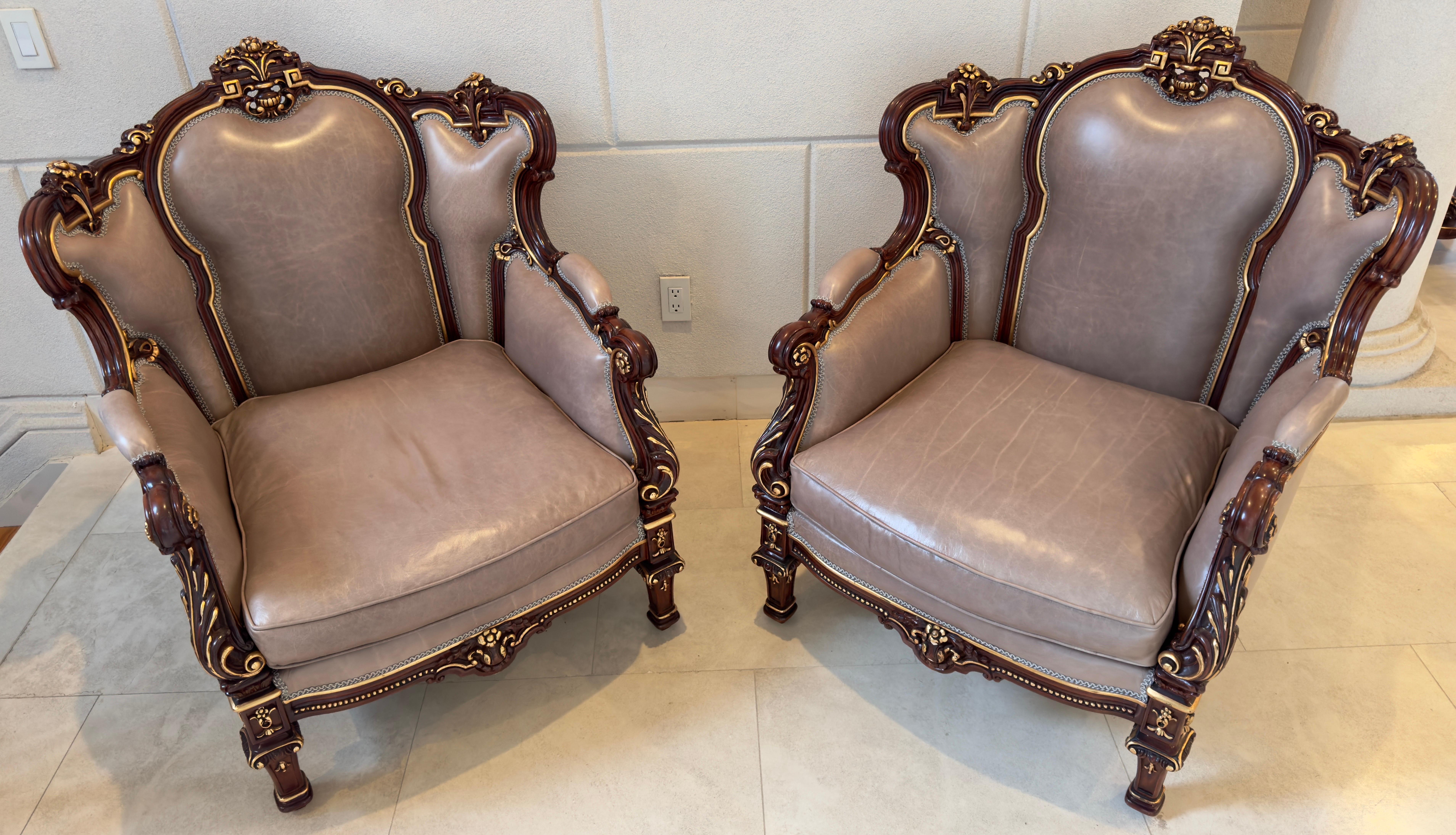 A captivating pair of Italian Rococo Style Carved Wood Berger Chairs, each a testament to the splendor of classical design. Crafted with precision, the frames exude opulence in rich mahogany, meticulously adorned with intricate carvings that speak