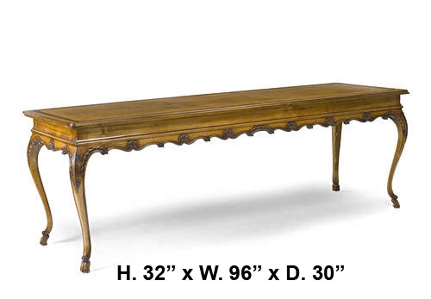 Italian Rococo style fruitwood long table with beautifully carved apron, on four slim cabriole legs.

Second half of the 20th century.