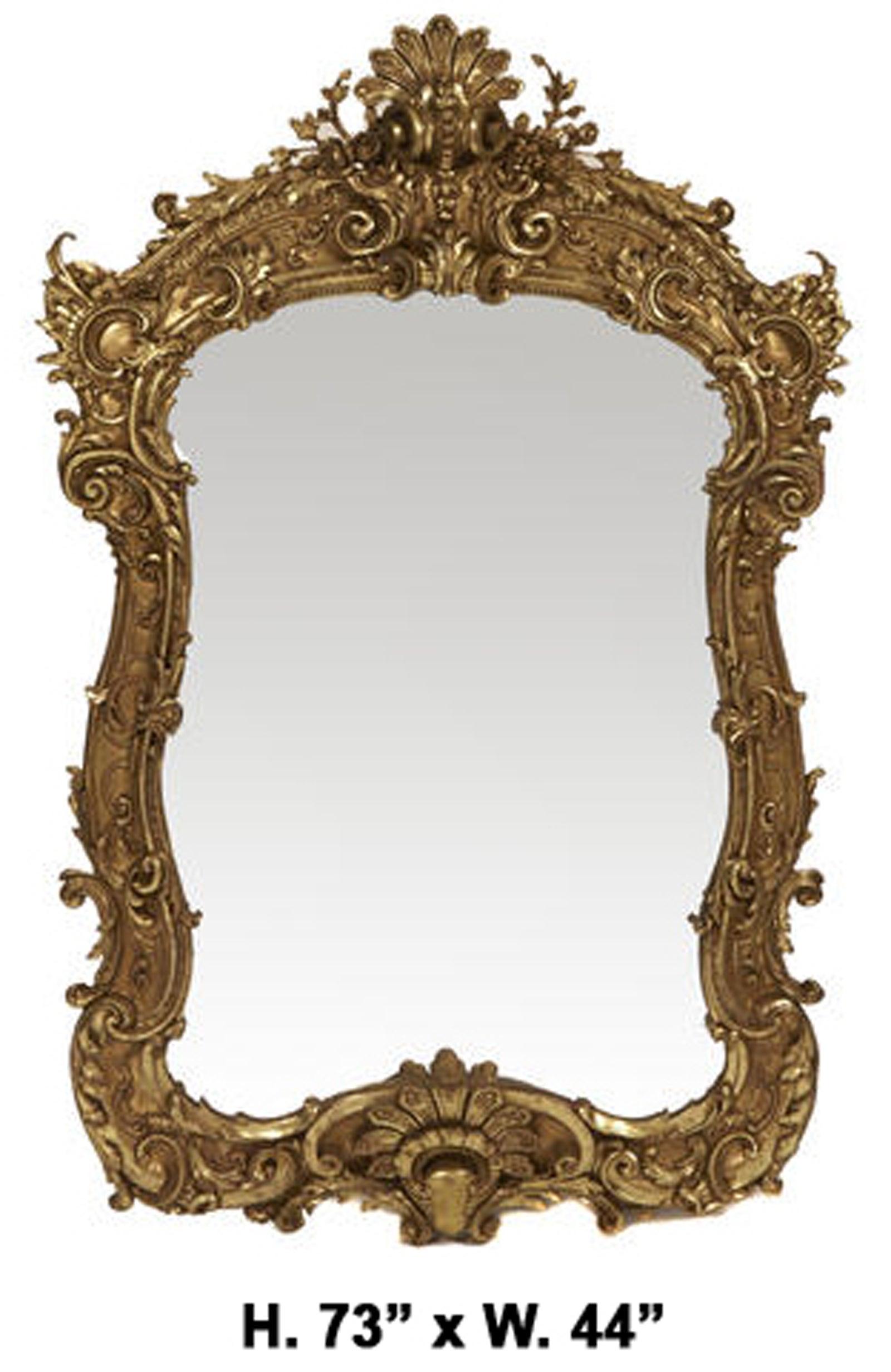 Fine Italian Rococo style composition and carved giltwood mirror.
Early 20th century.
The mirror is surmounted with a palmette, surrounded in a foliate motif, and fully decorated with intricately detailed Rocaille style scrolls, foliage and shells.