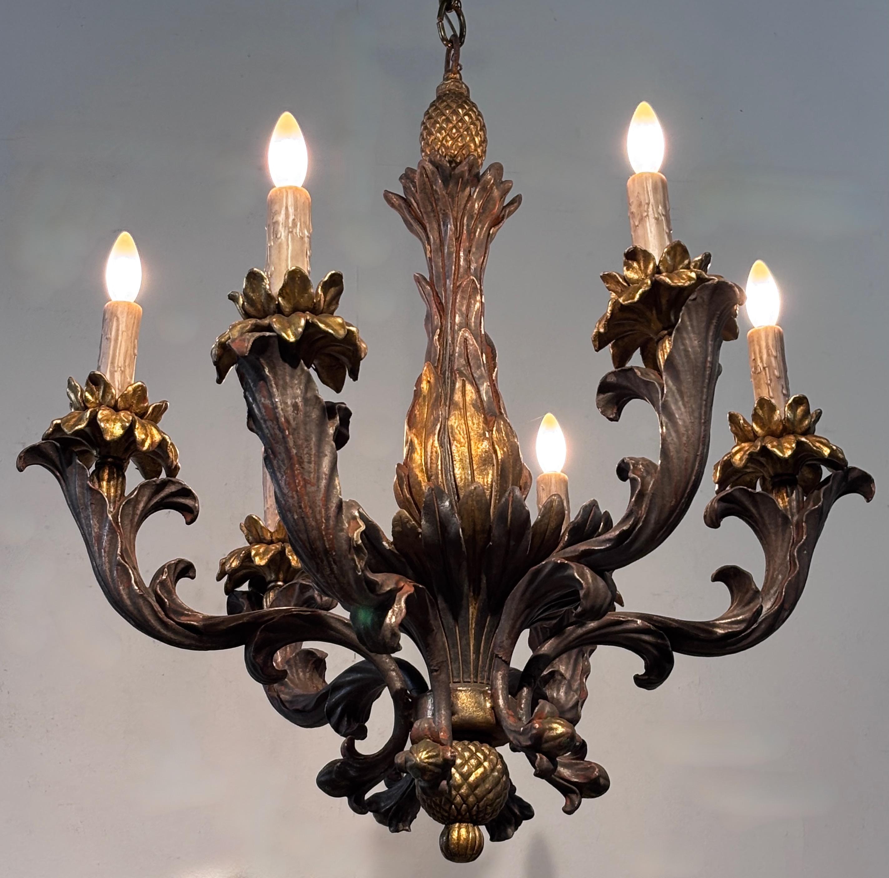 A Rococò style carved wood with gesso and gold and silver gilding light fixture. Recently re-wired and ready to install.
The fixture measures 30