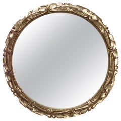 Miroir mural rond italien de style rococo en bois doré sculpté