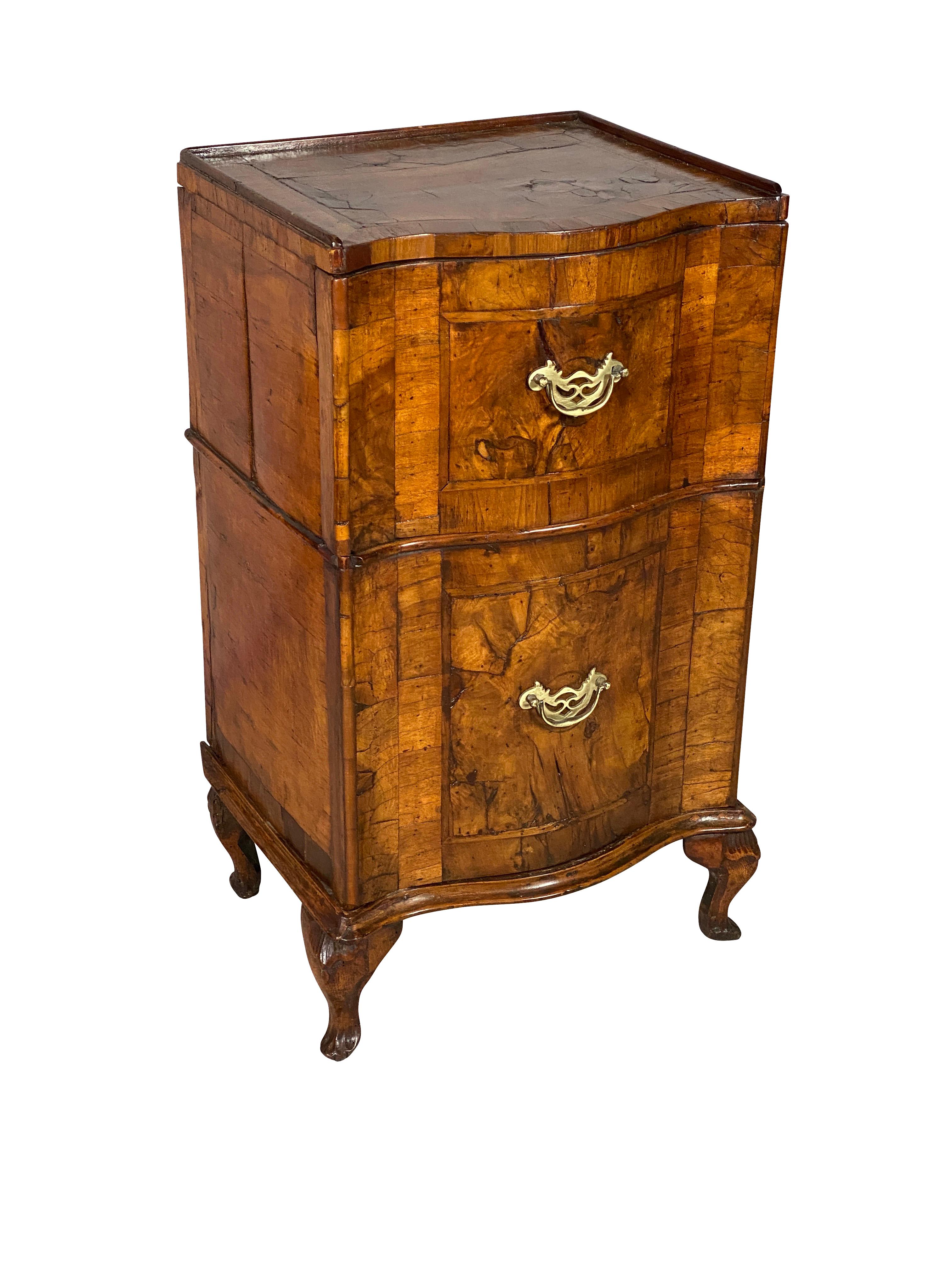 Squarish shaped top over two drawers raised on cabriole legs.