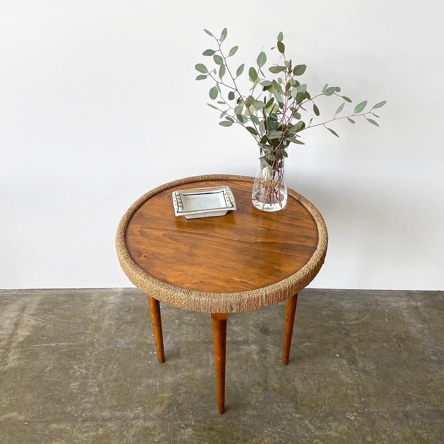 Italian rope cocktail table 
Italy, circa 1940’s
Woven rope banding outlines the frame of the table top
Sleek and slender wooden legs
Patina from and age use
Newly reconditioned.