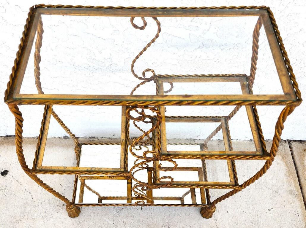 For FULL item description click on CONTINUE READING at the bottom of this page.

Offering One Of Our Recent Palm Beach Estate Fine Furniture Acquisitions Of A 
Vintage Rope Tassel Iron Gilt Table Shelves 
The bottom shelf is shown as a mirror but it
