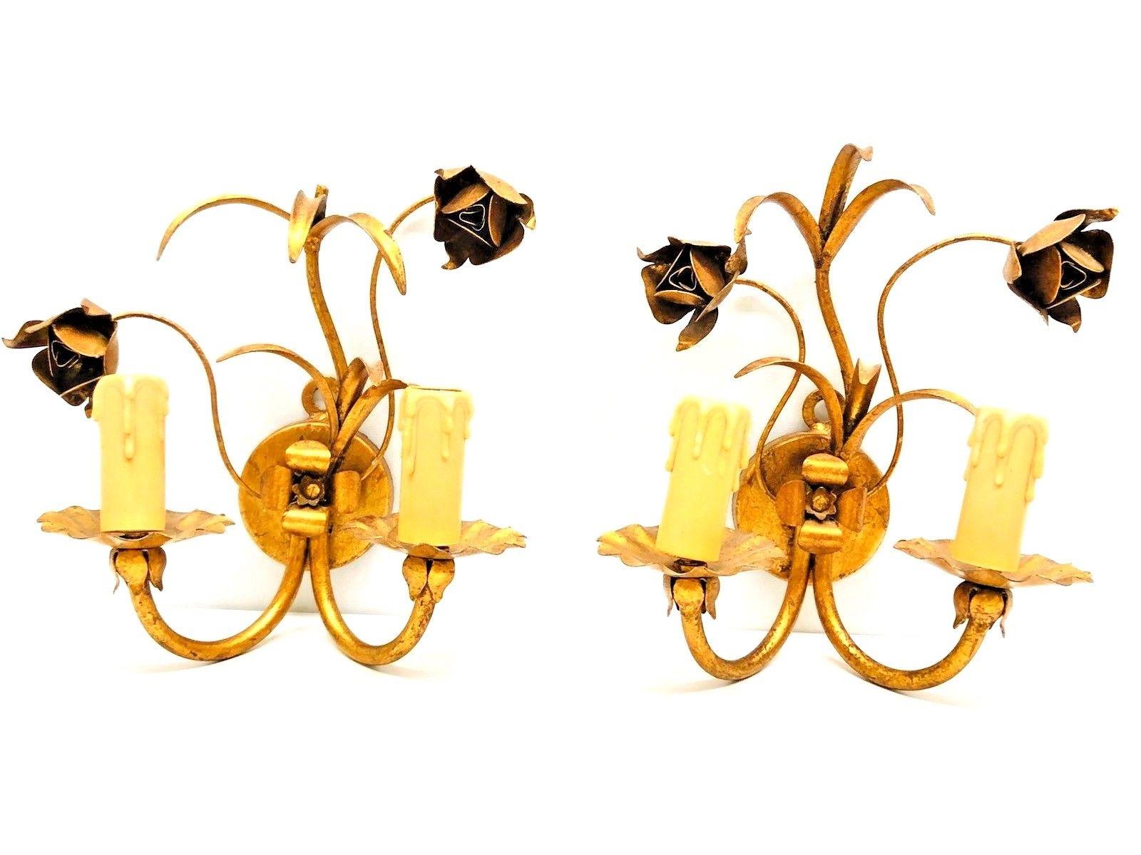 A pair Hollywood Regency midcentury gilt tole roses sconces, each fixture requires two European E14 candelabra bulbs, each bulb up to 40 watts. The wall lights have a beautiful patina and gives each room a eclectic statement.