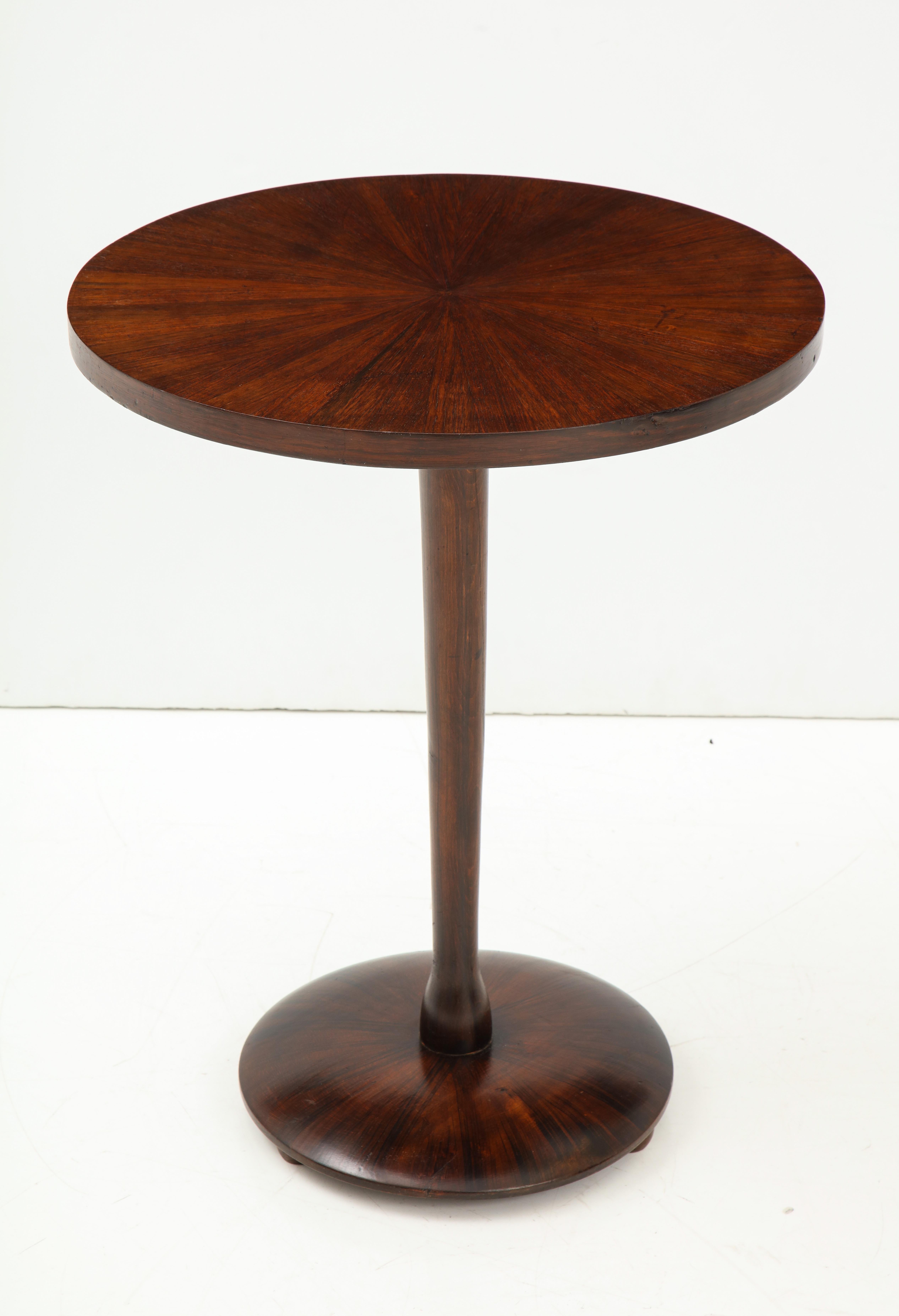 Italian rosewood circular side table with columnar support and shaped base.
Italy, circa 1960.
Size: 29” high x 23” diameter.