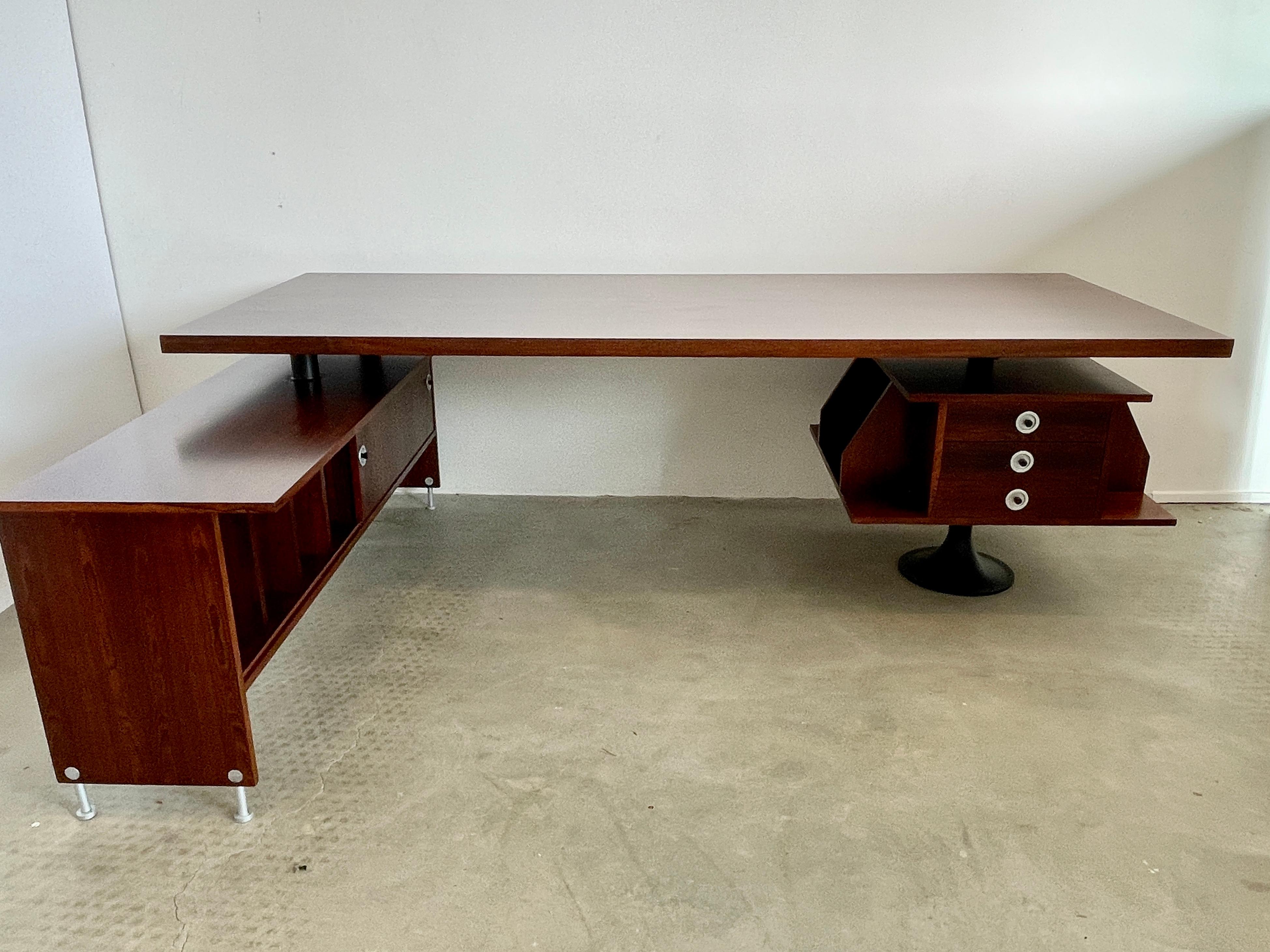 1960's Italian rosewood partner's desk for for Rossi di Albizzate
Metal base with 360 degree swiveling pedestal drawers - 
And credenza with sliding doors revealing ample storage.
Newly refinished - 

Measures: Desk 86 3/4